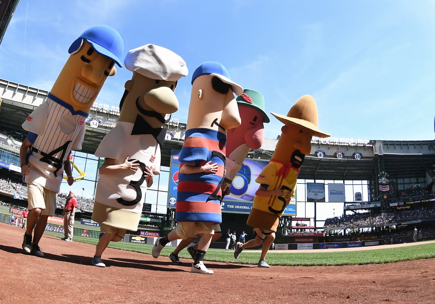 The Milwaukee Brewers' racing sausages, seen in 2017 at Miller Park. The chairman of the Wisconsin Republican Party warned Milwaukee's chief elections official that it would be illegal for any Milwaukee Bucks or Brewers players or mascots to participate in early voting events planned at their stadiums.