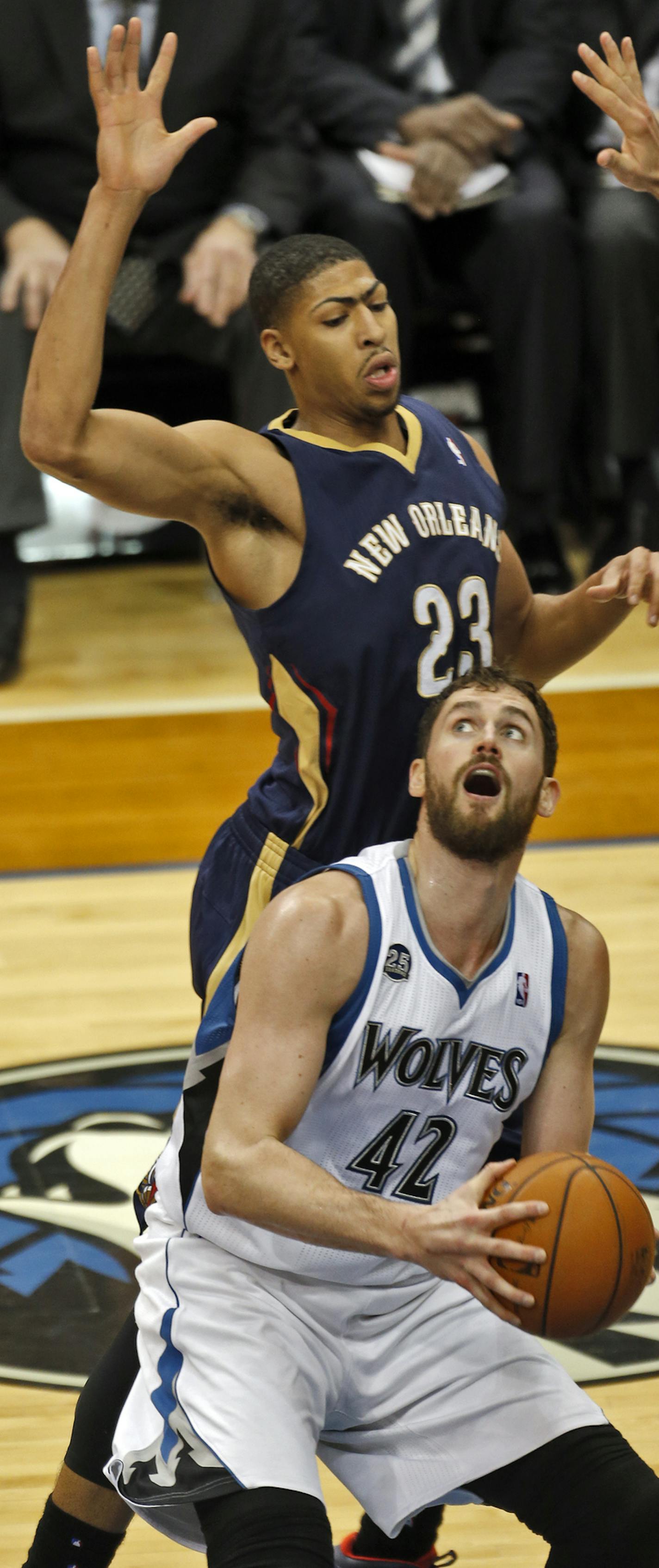 Minnesota Timberwolves vs. New Orleans Pelicans. Minnesota won 124-112. Wolves Kevin Love faked Pelicans Anthony Davis into the air before going up for a 2nd half shot. (MARLIN LEVISON/STARTRIBUNE(mlevison@startribune.com)