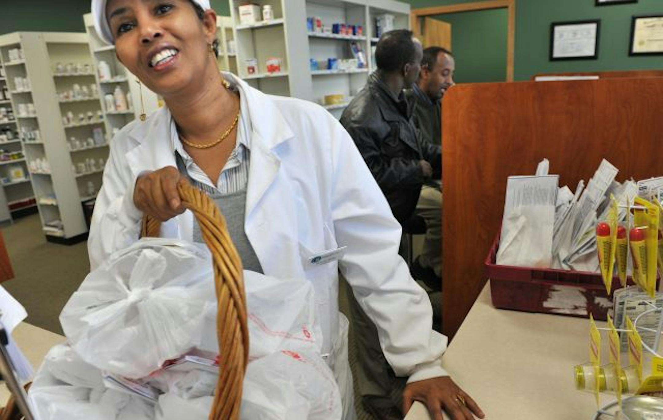 Berlin Farah, one of the partners in Global Health Mart Pharmacy, prepared a group of prescriptions for delivery to customers. The pharmacy is owned and operated by people from Somalia and can provide patients with medication instructions in Somali.