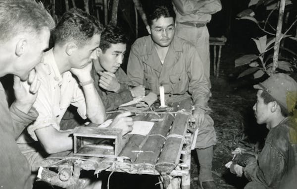 Nisei linguists S. Phil Ishio and Arthur K. Ushiro helped interrogate a Japanese prisoner in Papua New Guinea in 1943.