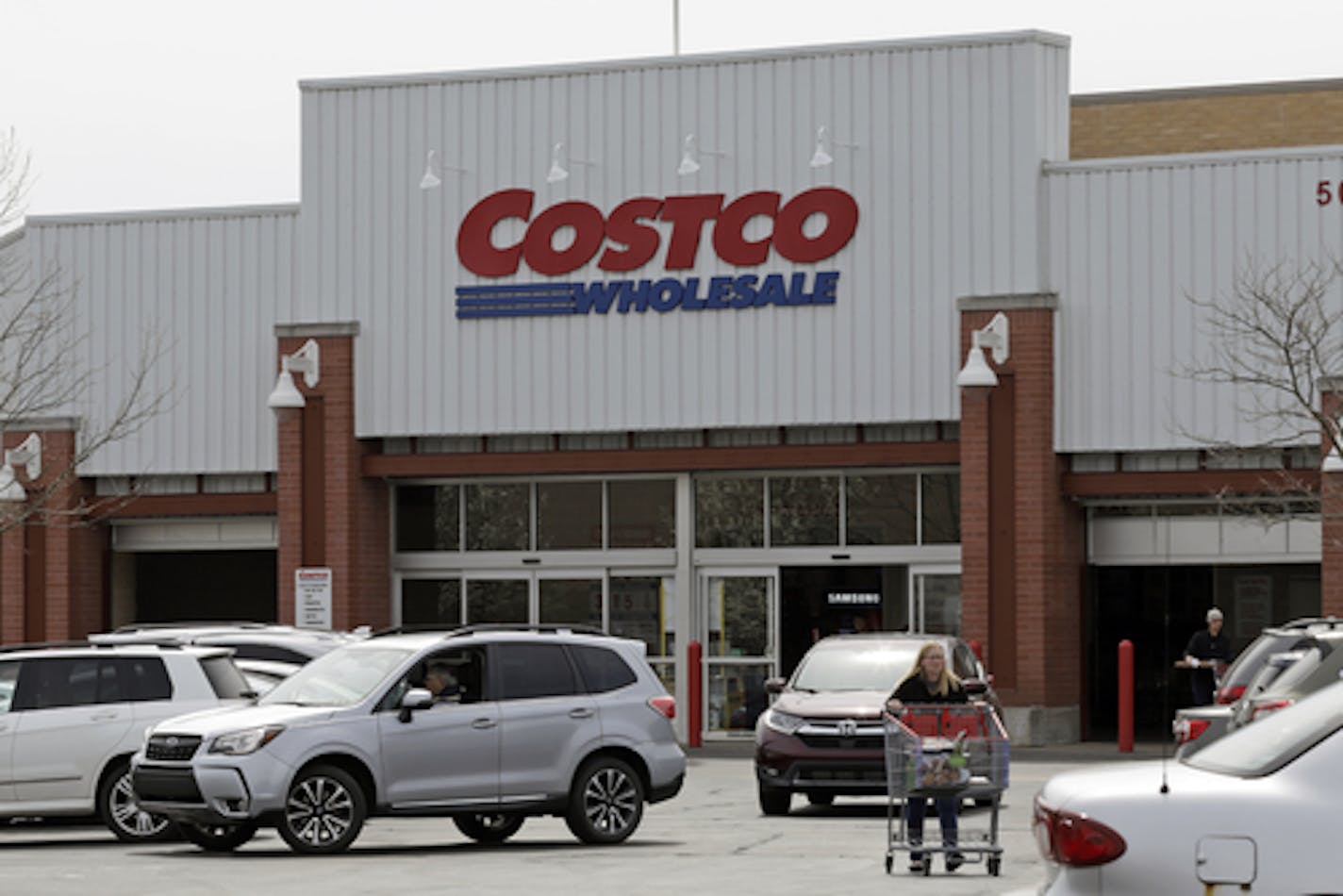 FILE - In this April 11, 2019, file photo people shop at a Costco store in Homestead, Pa. The Gap Inc. reports financial results Thursday, May 30, 2019. (AP Photo/Gene J. Puskar, File) ORG XMIT: MER073341fd041f3bb5fb50925883e6d