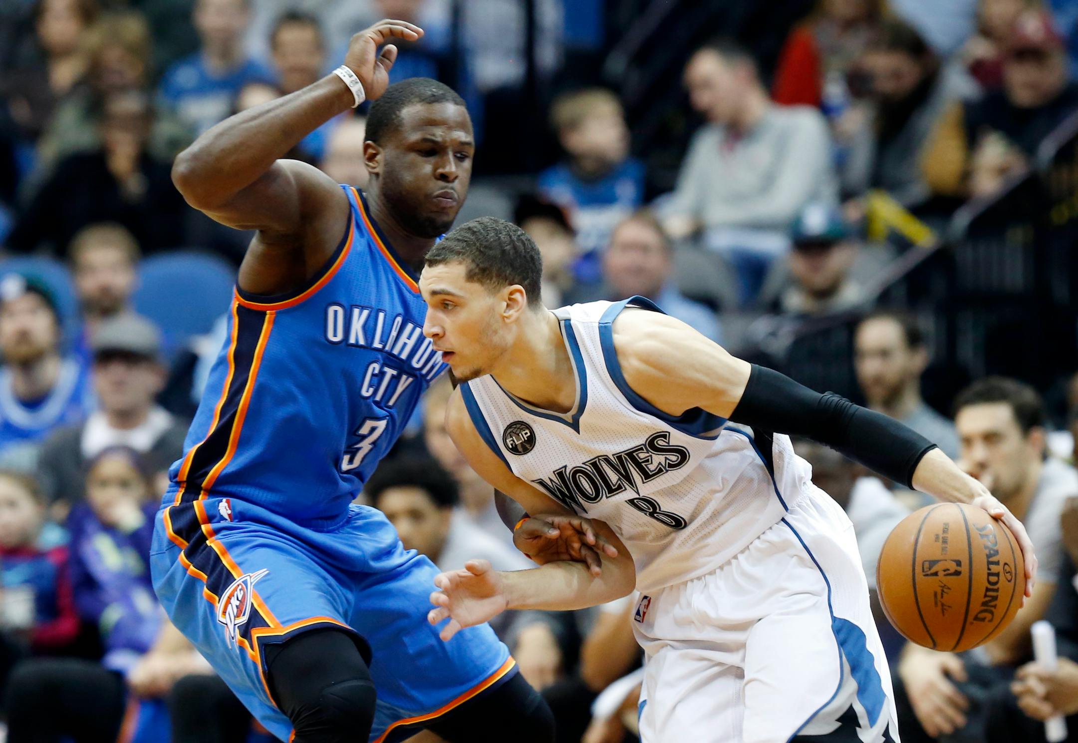 Timberwolves guard Zach LaVine drove around Oklahoma City's Dion Waiters in the second half Tuesday night. The Thunder won 101-96, but LaVine scored 21 points.