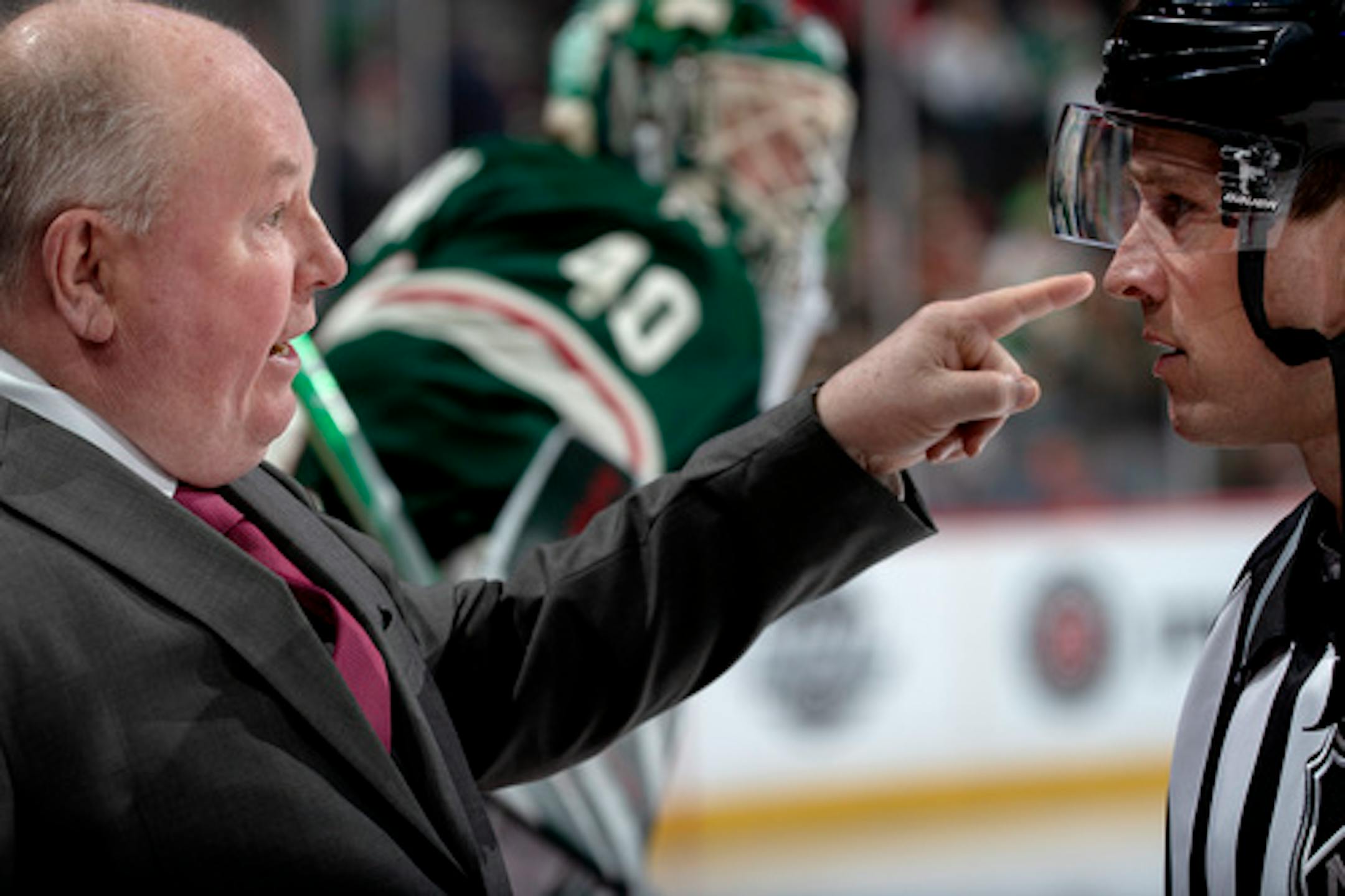 Wild head coach Bruce Boudreau spoke to a referee before the start of the second period.