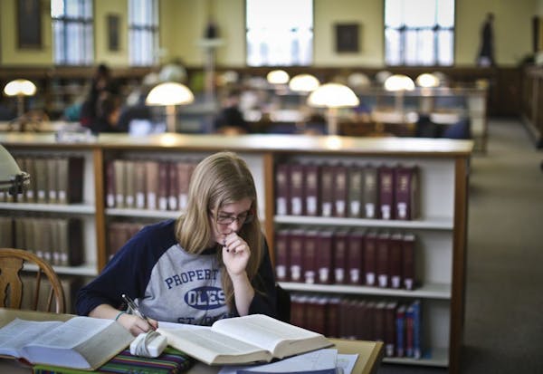 Dec. 2012: A student researches a religion paper at the library at St. Olaf College in Northfield, Minn.