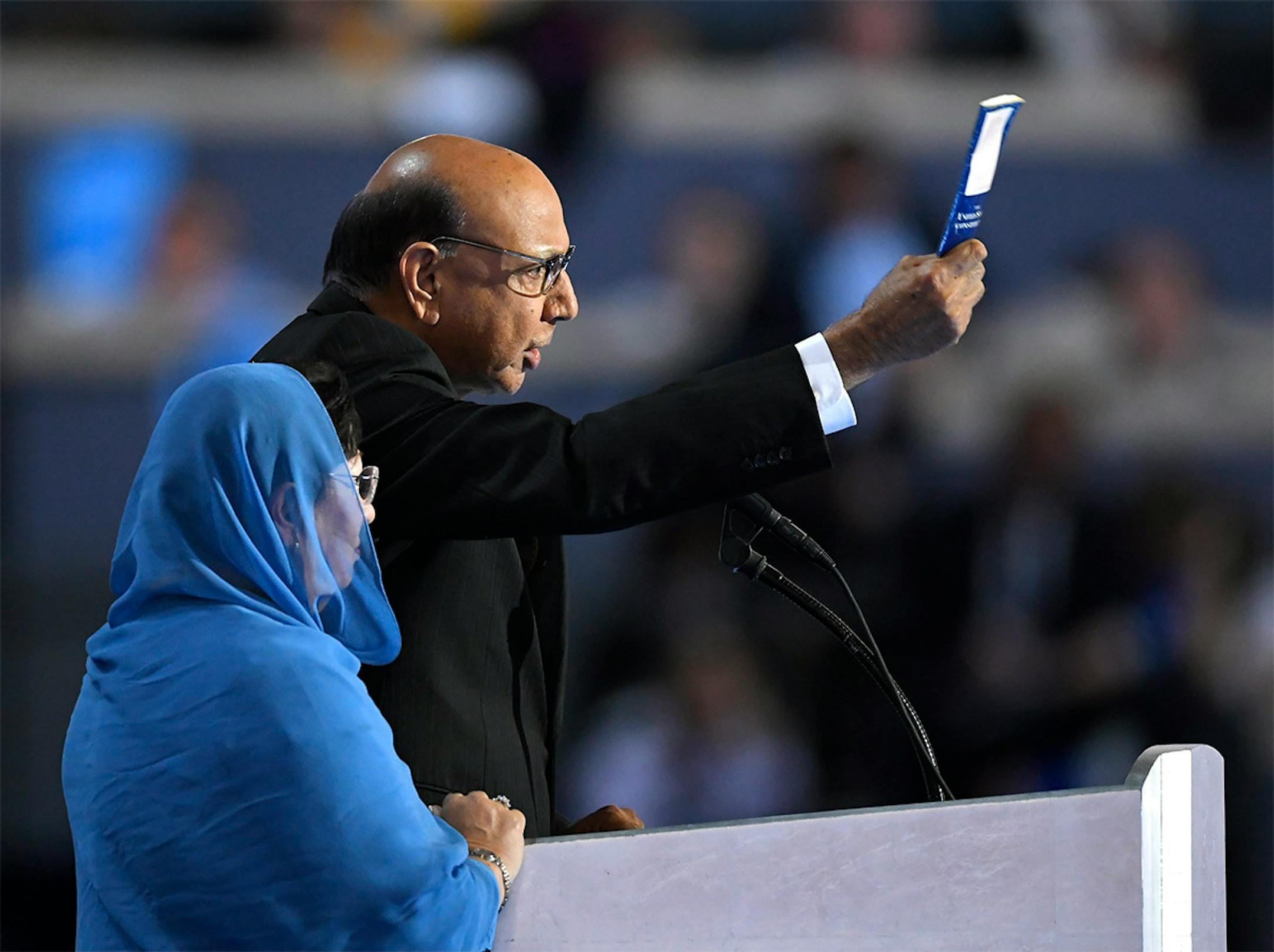 Khizr Khan, father of fallen US Army Capt. Humayun S. M. Khan, holds up his copy the United State Constitution as he speaks during the final day of the Democratic National Convention in Philadelphia , Thursday, July 28, 2016.