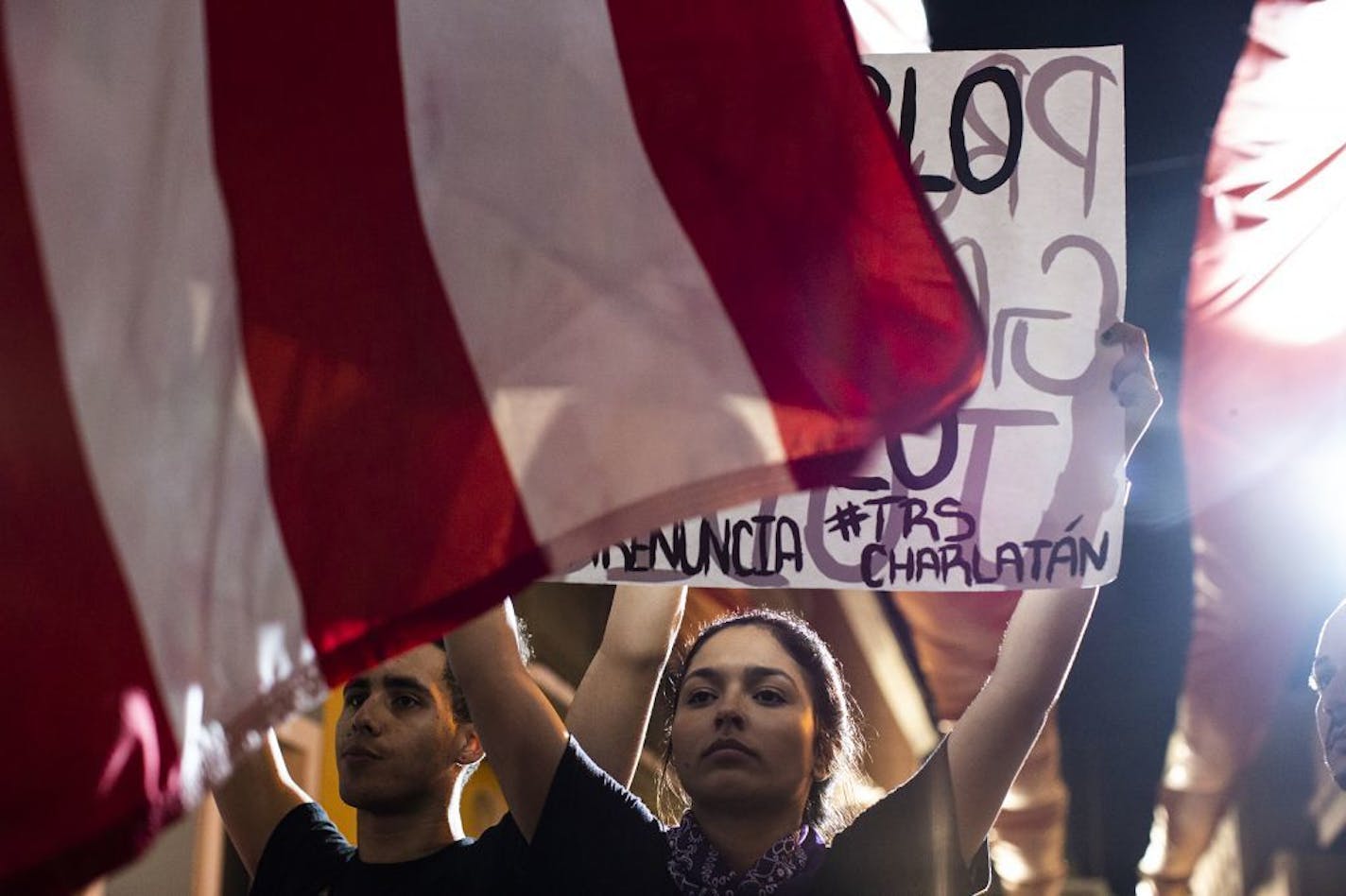 Protesters outside the governor's mansion in San Juan, P.R., Jan. 20, 2020. Governor Wanda Vázquez dismissed three members of her cabinet after a warehouse of unused emergency supplies was discovered, but some Puerto Ricans still took to the streets in protest.