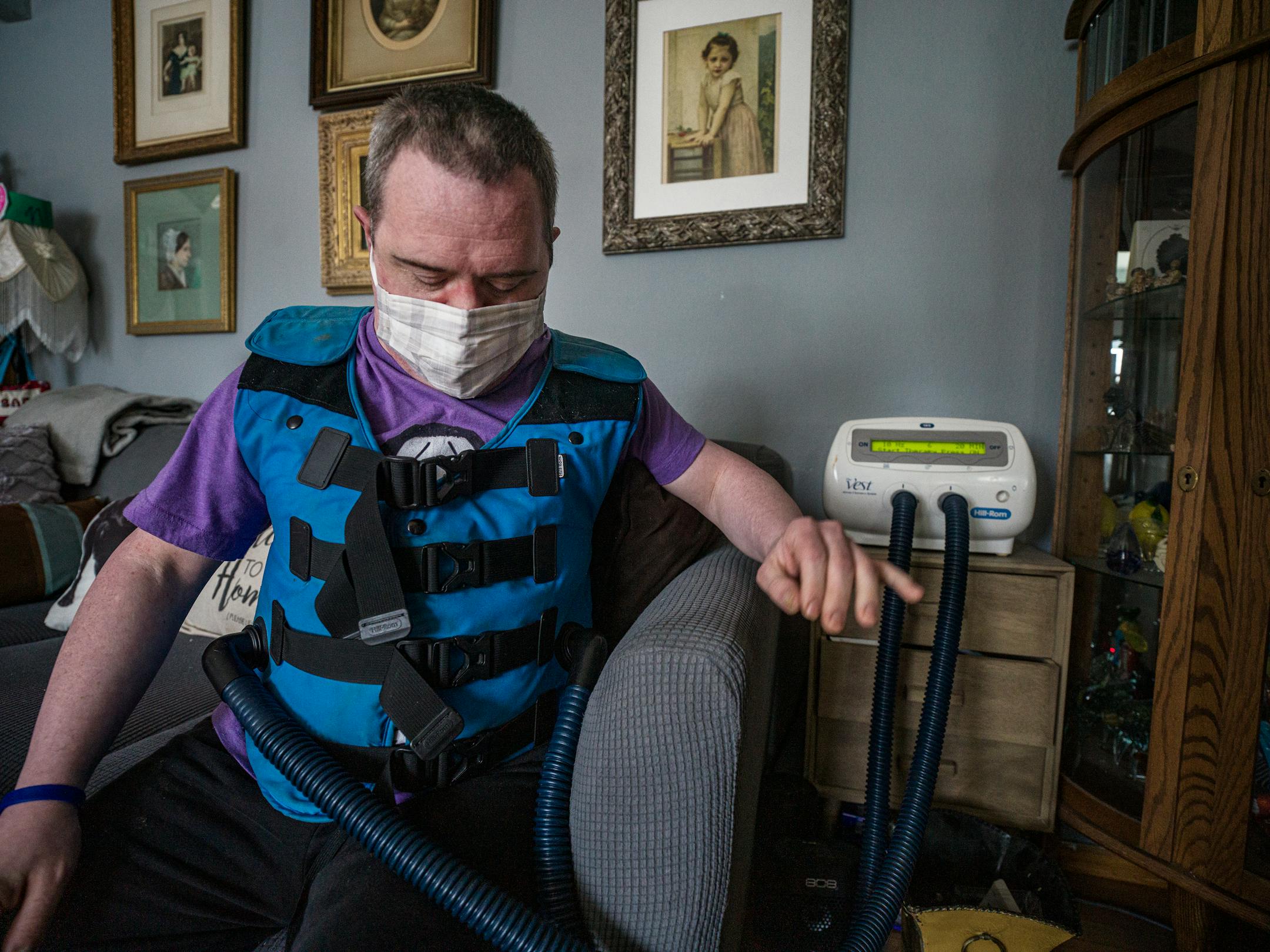 Sam Corbett uses a vibrating vest for his respiratory issue, which is one of the reasons his mother found it urgent for him to be vaccinated.