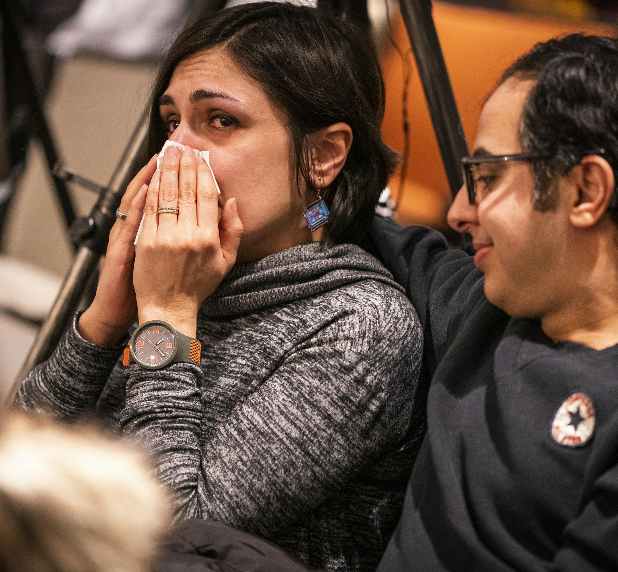Elham Nikoo, a professor at University of Wisconsin- Stout, traveled to the memorial with her husband Hasan Roshan, right, for a chance to grieve with her Iranian-American community. ] LEILA NAVIDI • leila.navidi@startribune.com BACKGROUND INFORMATION: A memorial was held for the victims of Ukraine International Airlines Flight 752 that was mistakenly shot down by the Iranian government after takeoff from Tehran airport at the University of Minnesota in Minneapolis on Wednesday, January 1