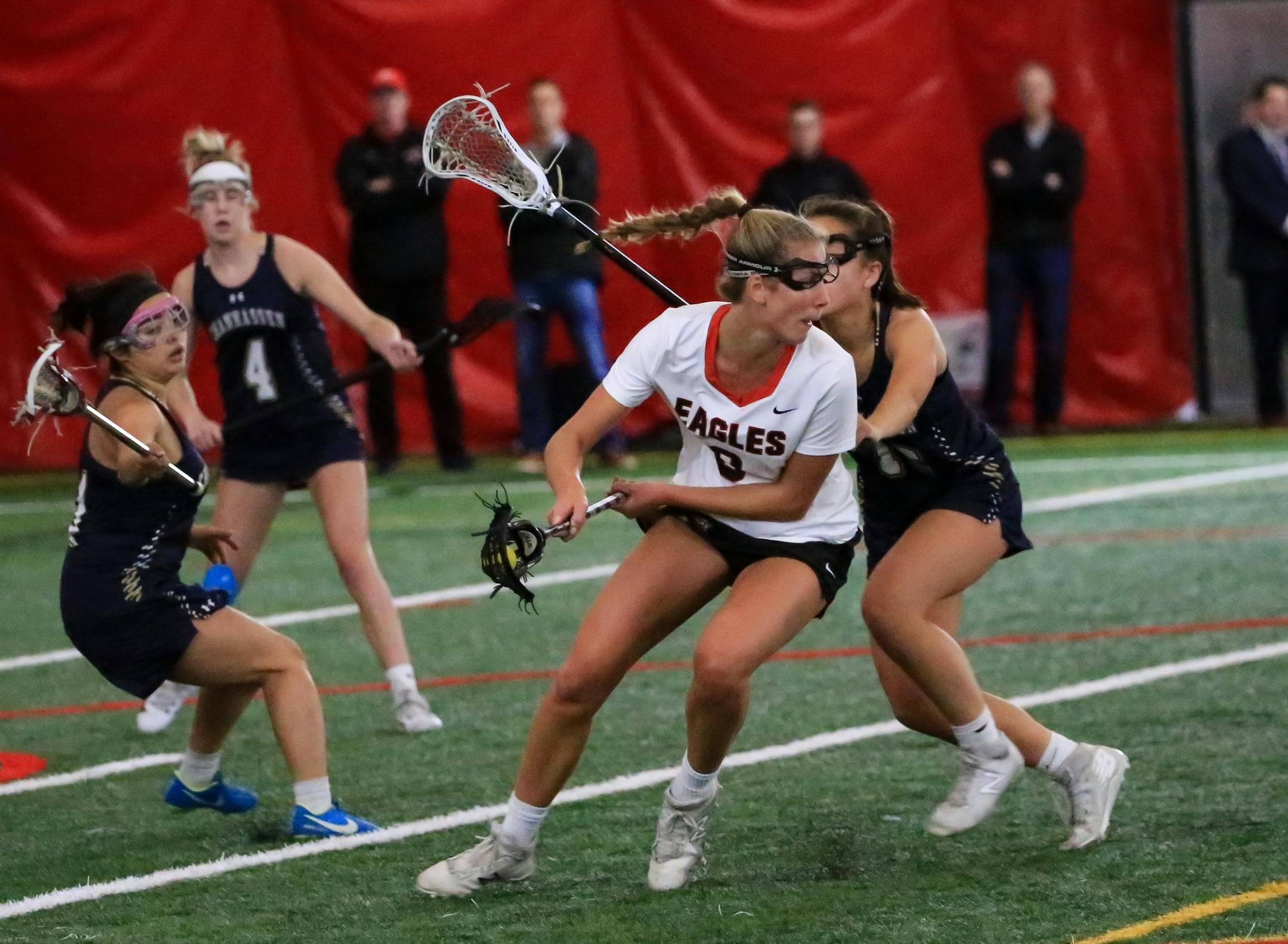 Senior Brooke Lewis of Eden Prairie, shown here surrounded by Chanhassen players in an April 30 game, said a victory this season over Prior Lake avenged a loss from last year and helped boost the Eagles' confidence. Photo: Cheryl Myers, SportsEngine