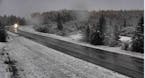 A MnDOT road camera shows the state’s first snow accumulation of the season near Ash Lake or 14 miles north of Orr, Minn.