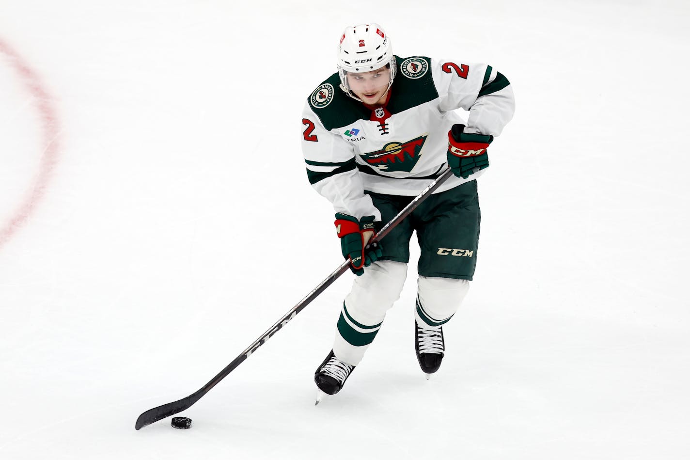 Minnesota Wild's Calen Addison plays against the Boston Bruins during the second period of an NHL hockey game, Saturday, Oct. 22, 2022, in Boston. (AP Photo/Michael Dwyer)