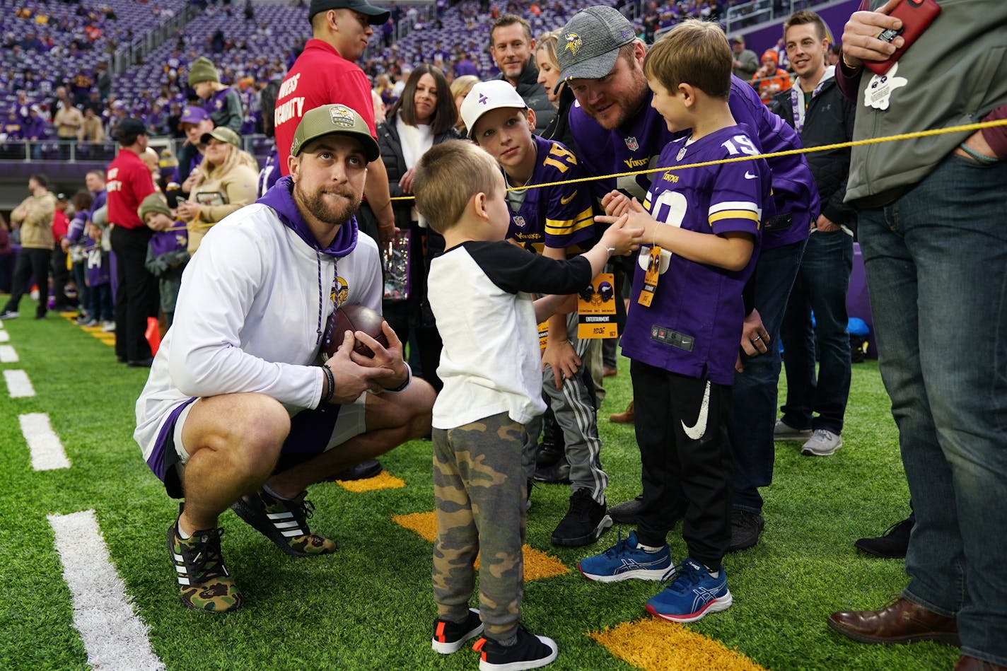 Minnesota Vikings wide receiver Adam Thielen (19) stood with his son Asher on the sidelines ahead of Sunday's game. ] ANTHONY SOUFFLE &#x2022; anthony.souffle@startribune.com The Minnesota Vikings played the Denver Broncos in an NFL game Sunday, Nov. 17k, 2019 at U.S. Bank Stadium in Minneapolis.