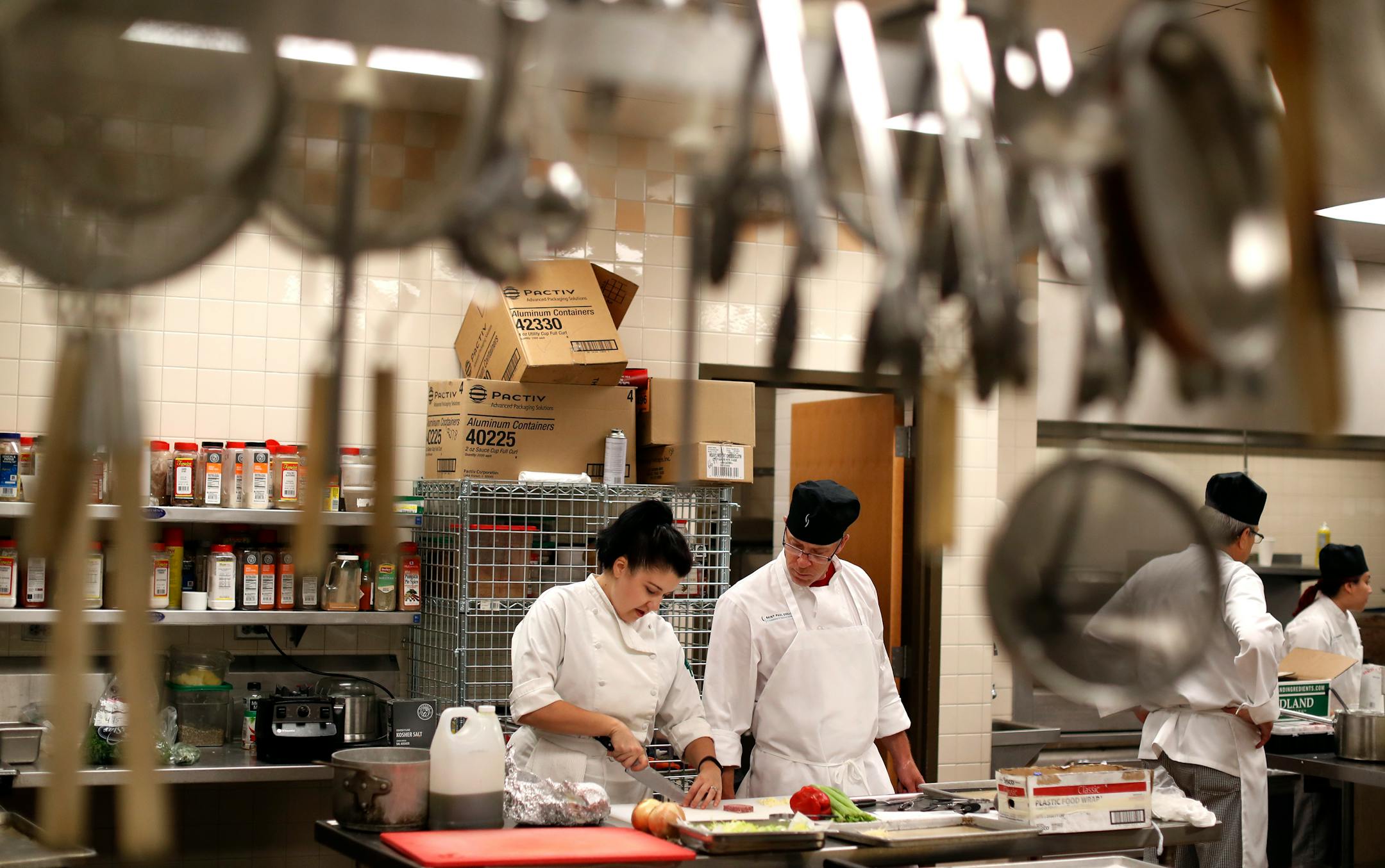 Chef Sara Johannes left helped David Frenette during a class at St. Paul College's culinary program September 13, 2016 in St. Paul, MN. ]  Jerry Holt / jerry. Holt@Startribune.com