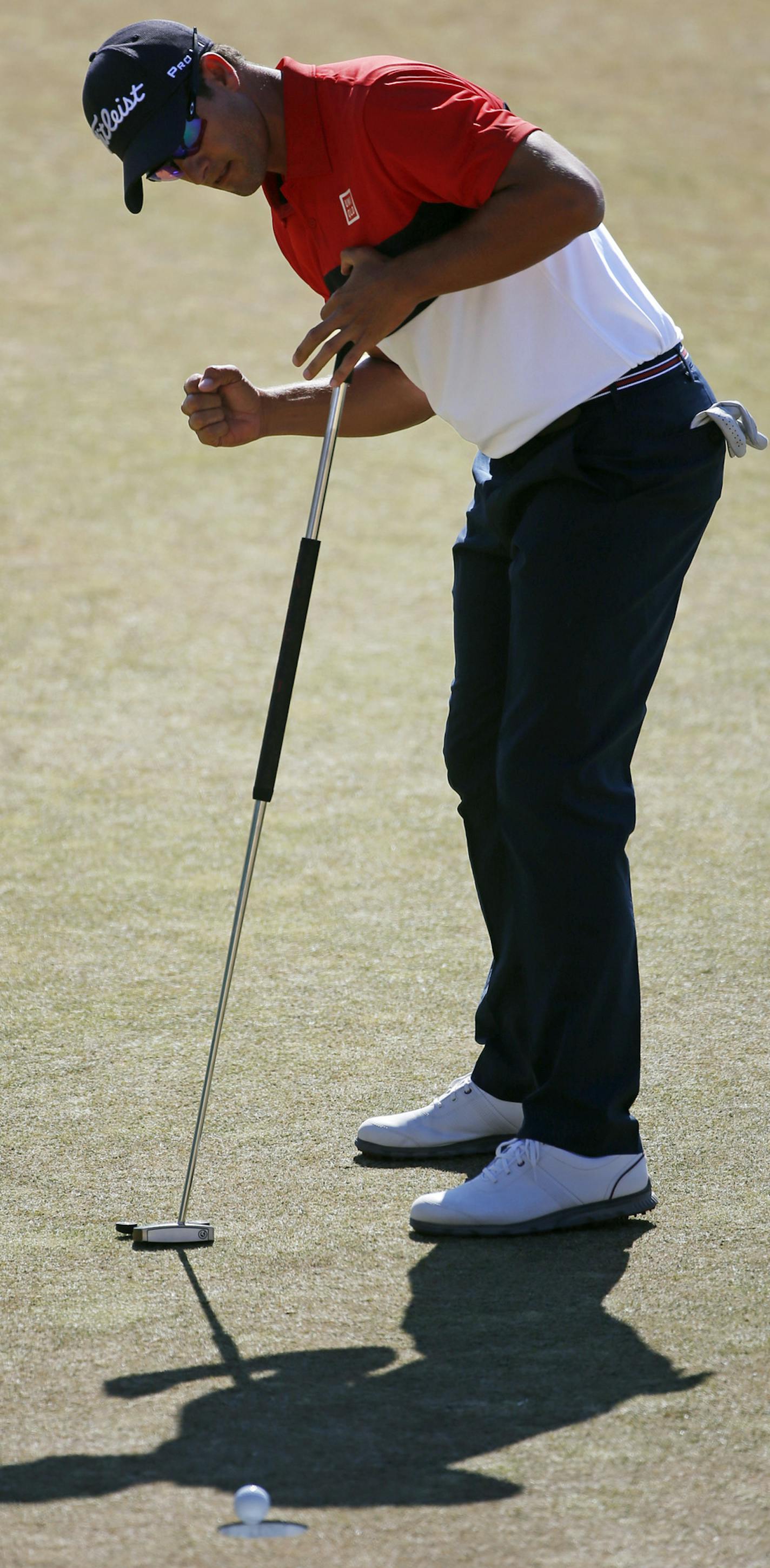 Adam Scott, of Australia, reacts to his putt on the 18th green during the final round of the U.S. Open golf tournament at Chambers Bay on Sunday, June 21, 2015 in University Place, Wash. (AP Photo/Lenny Ignelzi)