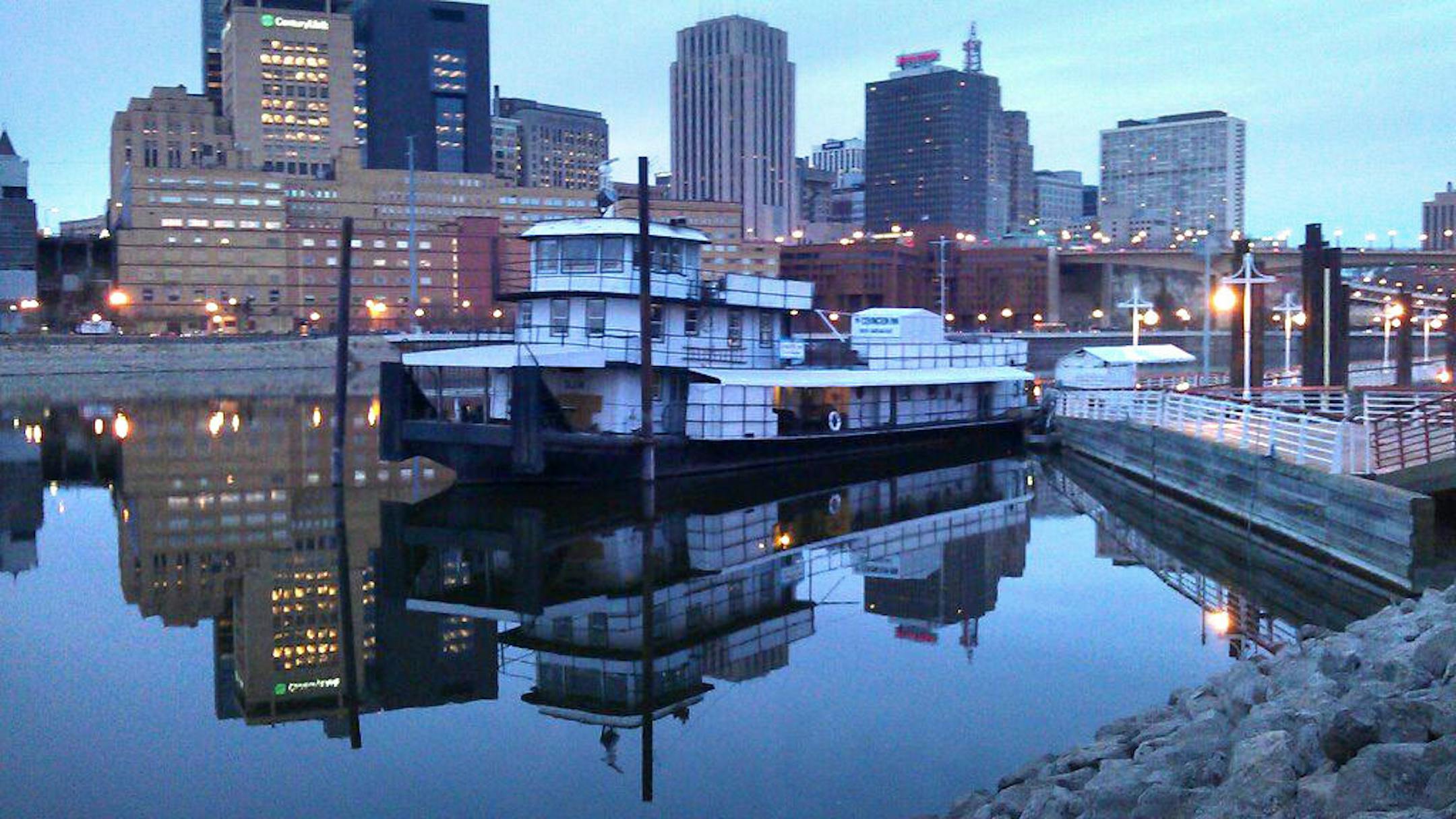 The Covington Inn is docked at Harriet Island in the shadow of the downtown St. Paul skyline.