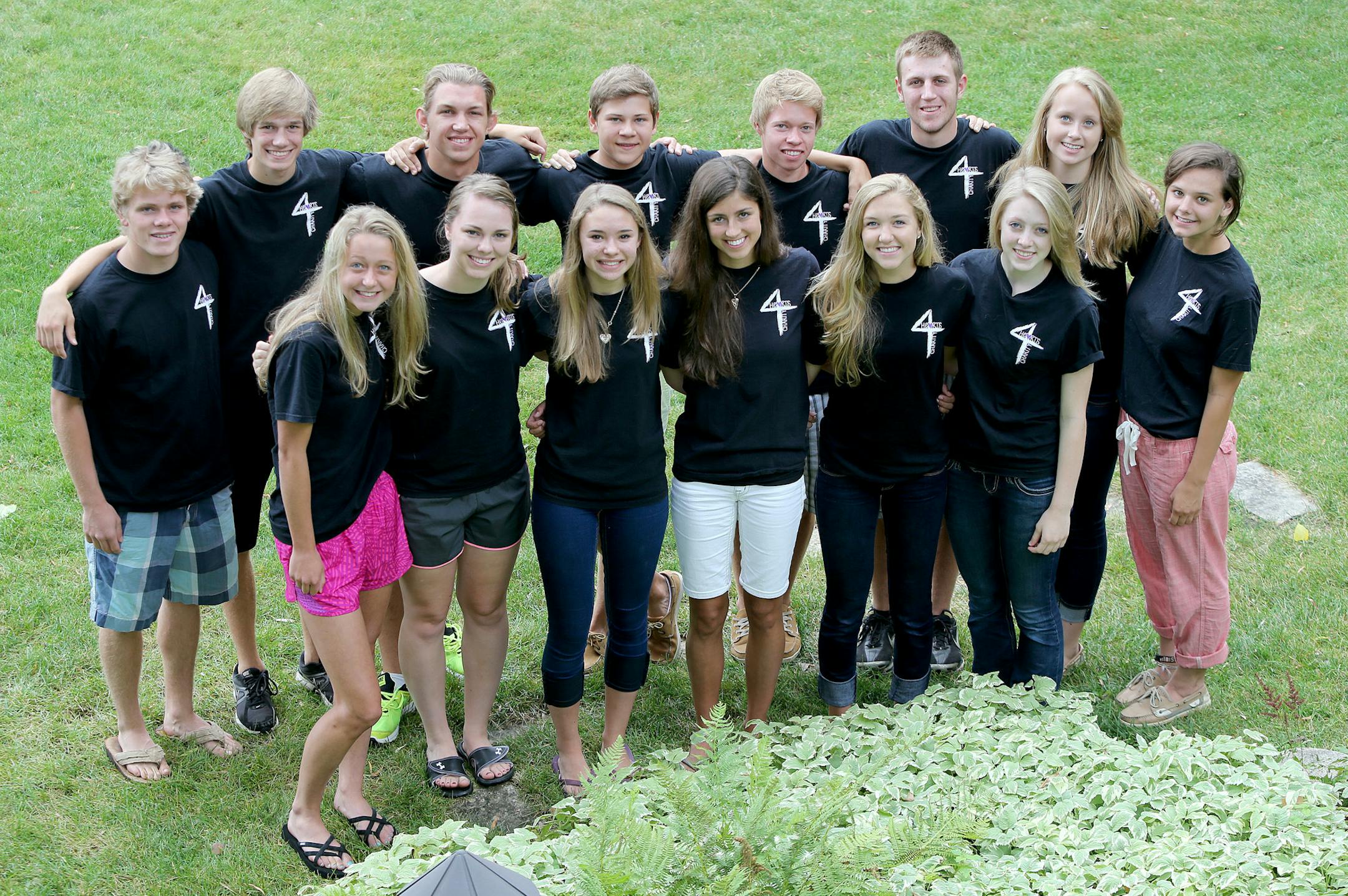 A group of Mahtomedi teens has recruited country singer Katie Armiger to raise money for Hearts4Charity, a mission to raise money for the International Justice Mission. The group, which includes from left top, Dane Nelson, Tyler Zappa, Nick Schwartz, Evan Molitor, Austin Fruits, Will Beety, Maddy Gildersleeve, and Georgie Holm, front from left, Greta Berger, Grace Kilgore, Katie Bartel, Amanda Sexson, Paige Welsh and Olivia Kramer, met for a meeting Tuesday, July 30, 2013 in Mahtomedi, MN. (ELIZ
