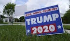 A campaign sign in support of President Donald Trump sits on a lawn Thursday, Oct. 22, 2020, in a Hispanic neighborhood of Miami. Florida's Cuban Amer