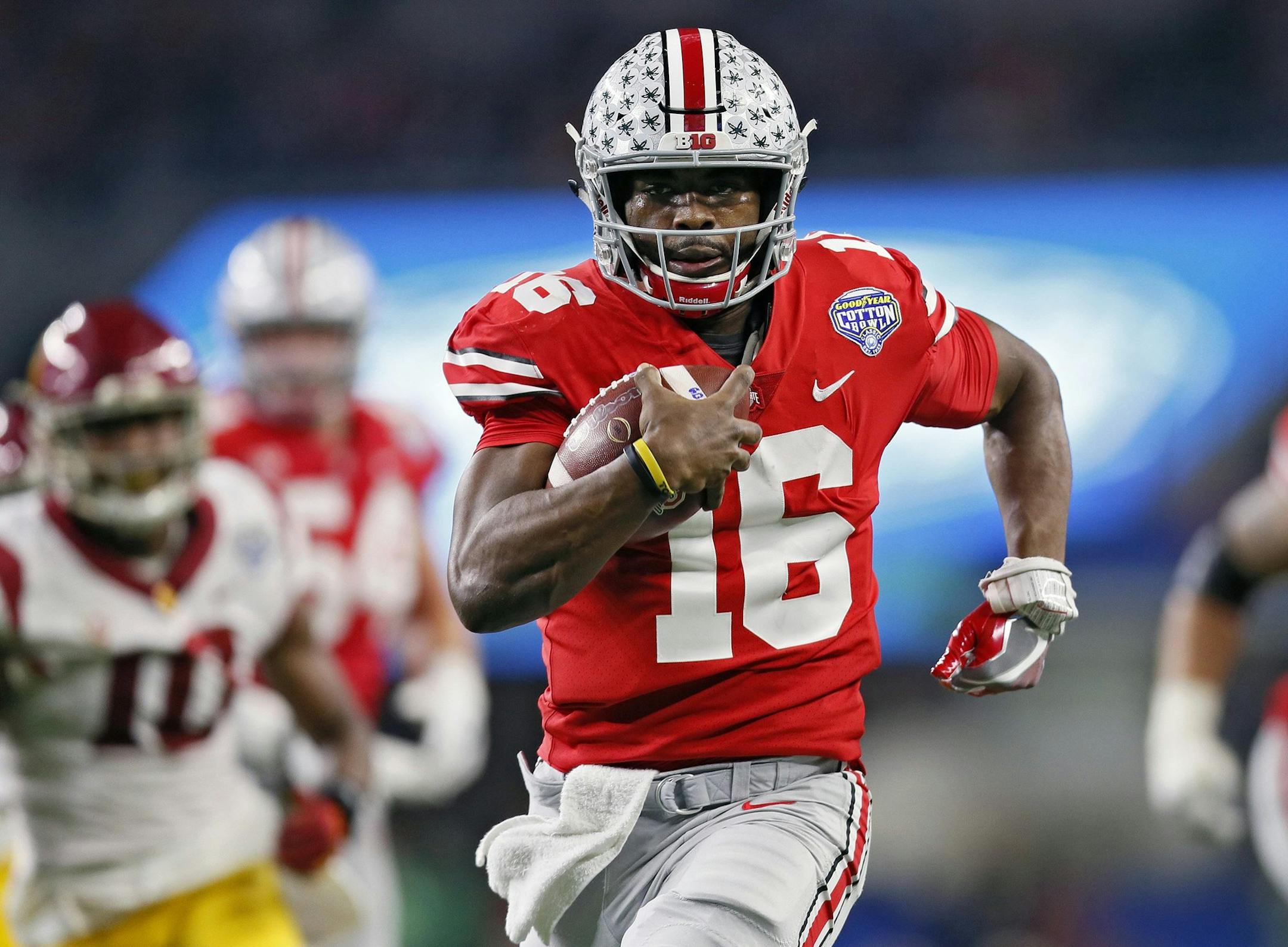 Ohio State quarterback J.T. Barrett (16) scores on a 28-yard run against USC in the first half during the Cotton Bowl at AT&T Stadium in Arlington, Texas, on Friday, Dec. 29, 2017. (Kyle Robertson/Columbus Dispatch/TNS) ORG XMIT: 1219844