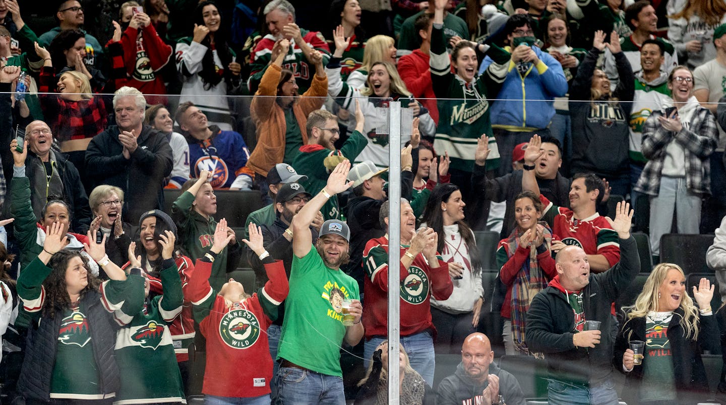 Minnesota Wild Fans celebrate an empty net goal in the third period Sunday, Nov. 7, 2021 at Xcel Energy Center in St. Paul, Minn. ] CARLOS GONZALEZ • cgonzalez@startribune.com