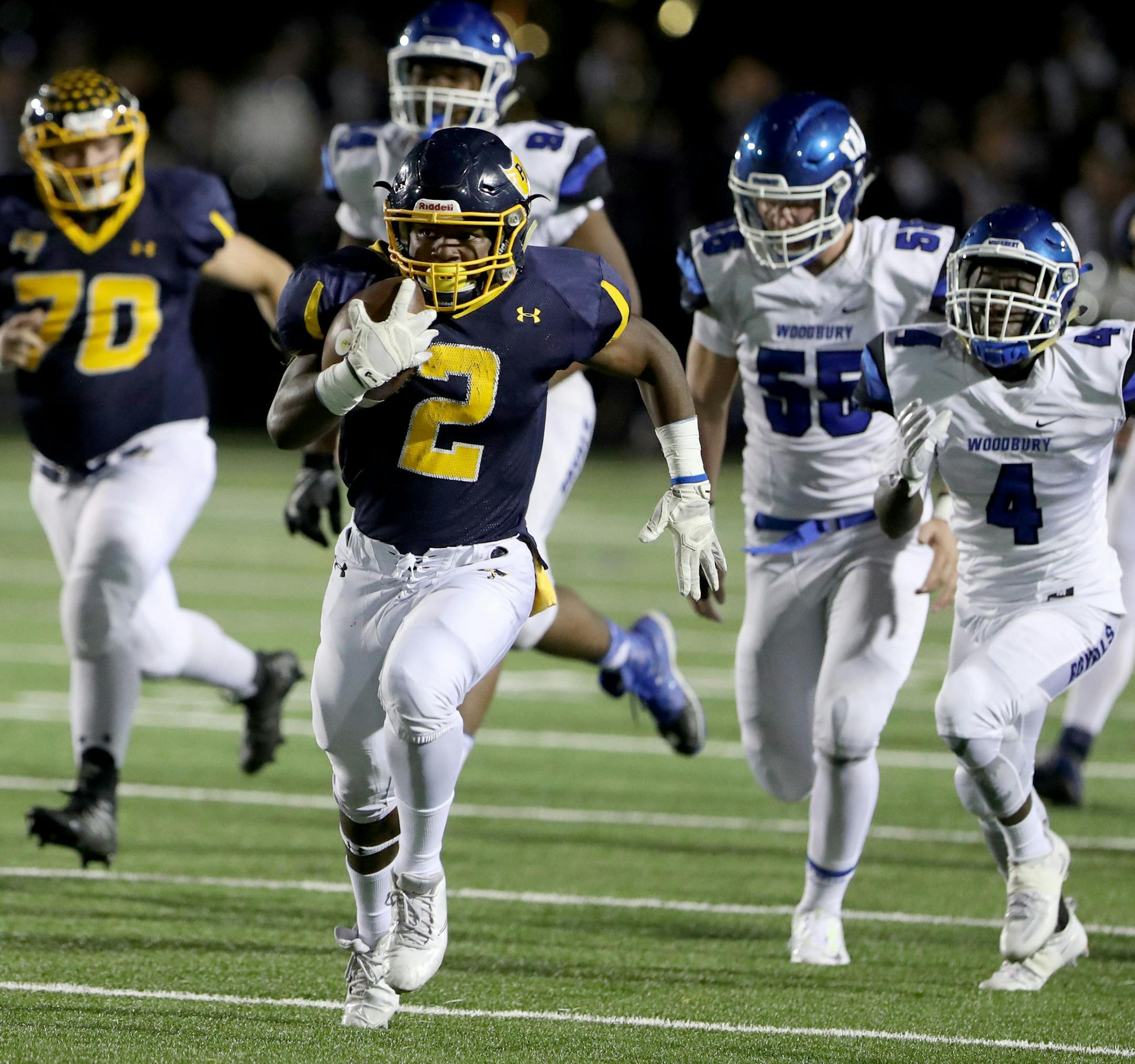 Prior Lake running back Jordan Johnson (2) broke multiple tackles against Woodbury en route to a 69 yard touchdown run during the second quarter of the Minnesota High School Class 6A football first round game at Prior Lake High School Friday, Oct. 28, 2016, in Savage, MN.](DAVID JOLES/STARTRIBUNE)djoles@startribune.com Minnesota High School Class 6A football first round, Woodbury at Prior Lake Friday, Oct. 28, 2016, in Savage, MN.**Jordan Johnson , cq