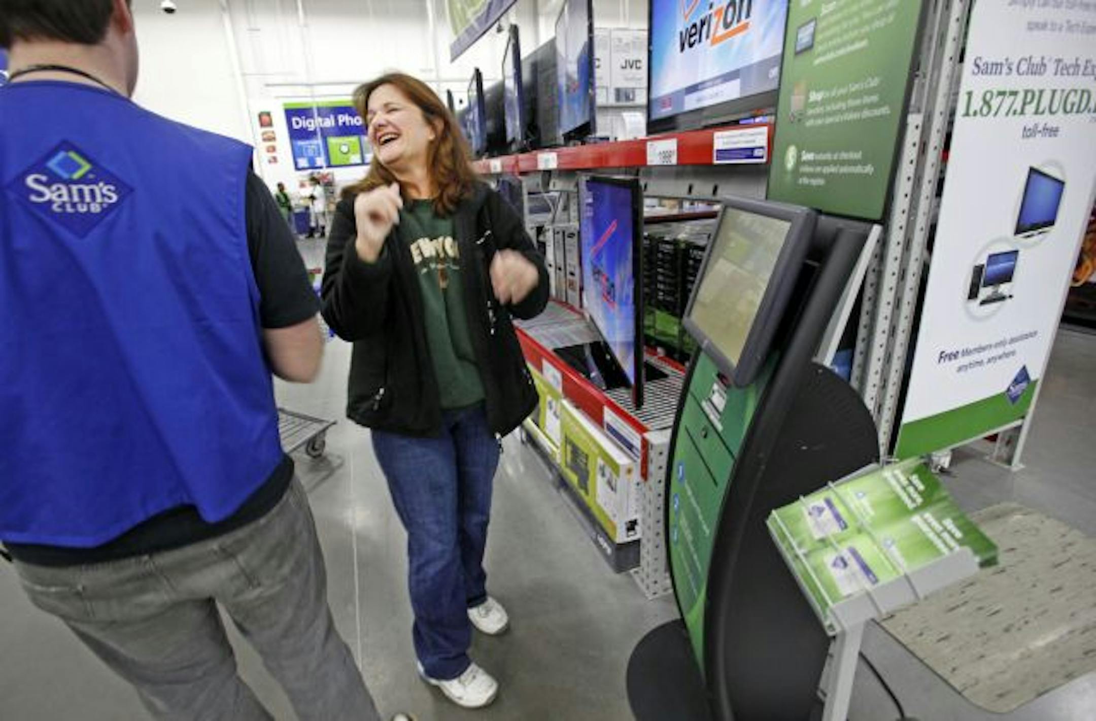 Minneapolis-based retailer Fair Isaac is helping retailers determine what customers want to buy using the same behind-the-scenes mathematical forumlas that drive the software company's flagship credit scoring product, the FICO score.FICO describes its Retail Action Manager 2.0 as a "decision management system that helps you deliver the right message to the right customer at the right time." Sam's Club was FICO's first client for this tool. In this photo:] Sam's Club member Lori Mullins, who wor