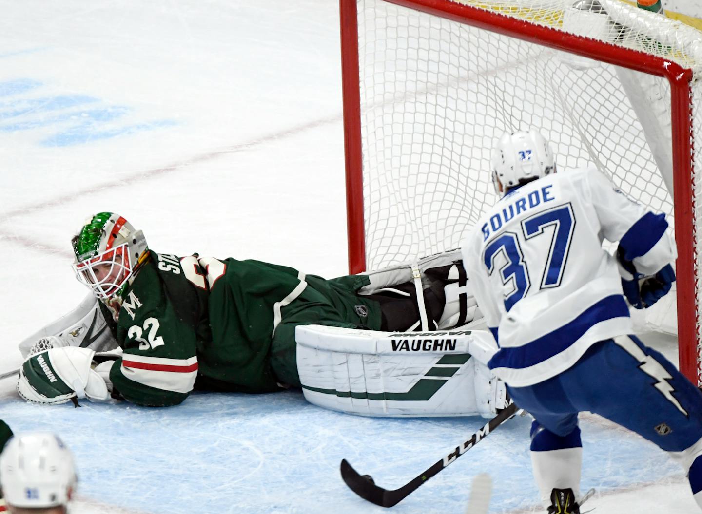 Tampa Bay Lightning's Yanni Gourde scores a goal against Wild goaltender Alex Stalock in October.