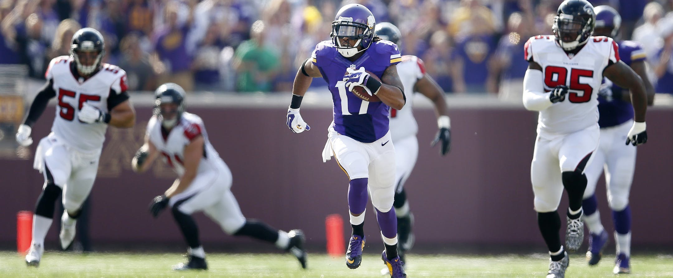 Minnesota Vikings Jarius Wright (17) ran from Falcons defenders during a 52-yard catch and run in the first quarter. ] CARLOS GONZALEZ cgonzalez@startribune.com - September 28 , 2014 , Minneapolis, Minn., NFL, TCF Bank Stadium, Minnesota Vikings vs. Atlanta Falcons