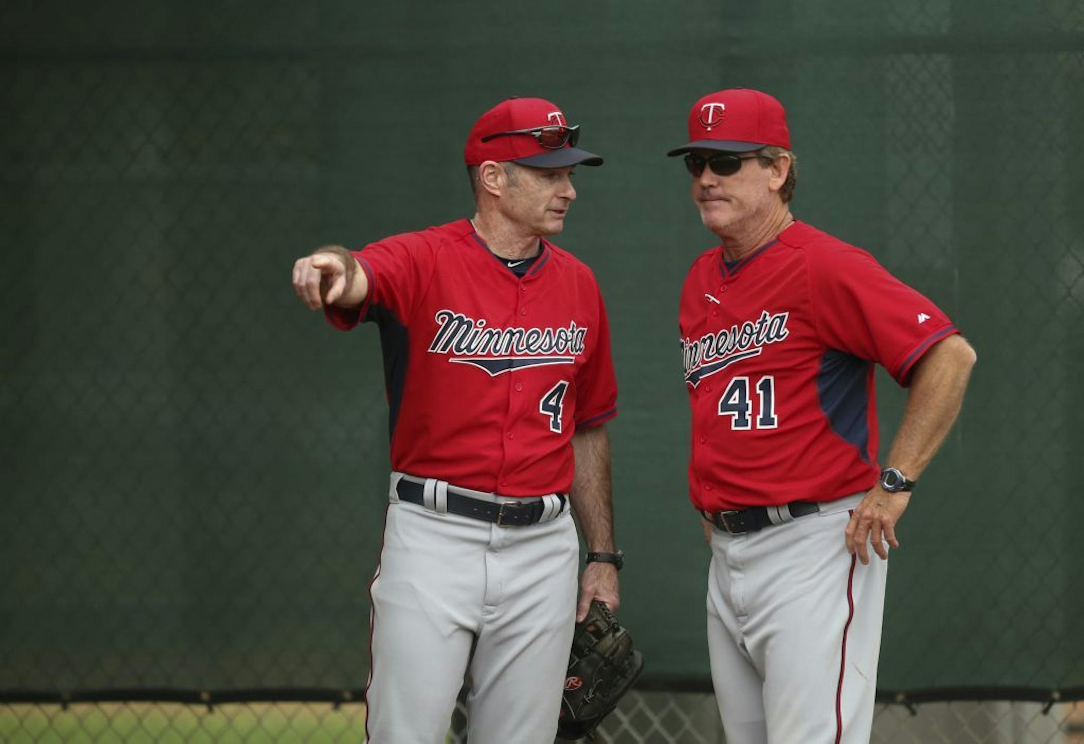 Twins pitching coach Neil Allen 941) and manager Paul Molitor (4) conferred in the bullpen Wednesday morning at Hammond Stadium.