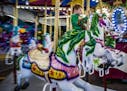 Eliah Goodwin,4, got to enjoy the carousel by himself on a school night.] The State Fair at night is an interesting place and different animal from th