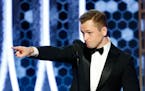 Taron Egerton accepted the award for best actor in a motion picture comedy for his role in "Rocketman" at the 77th Annual Golden Globe Awards at the B
