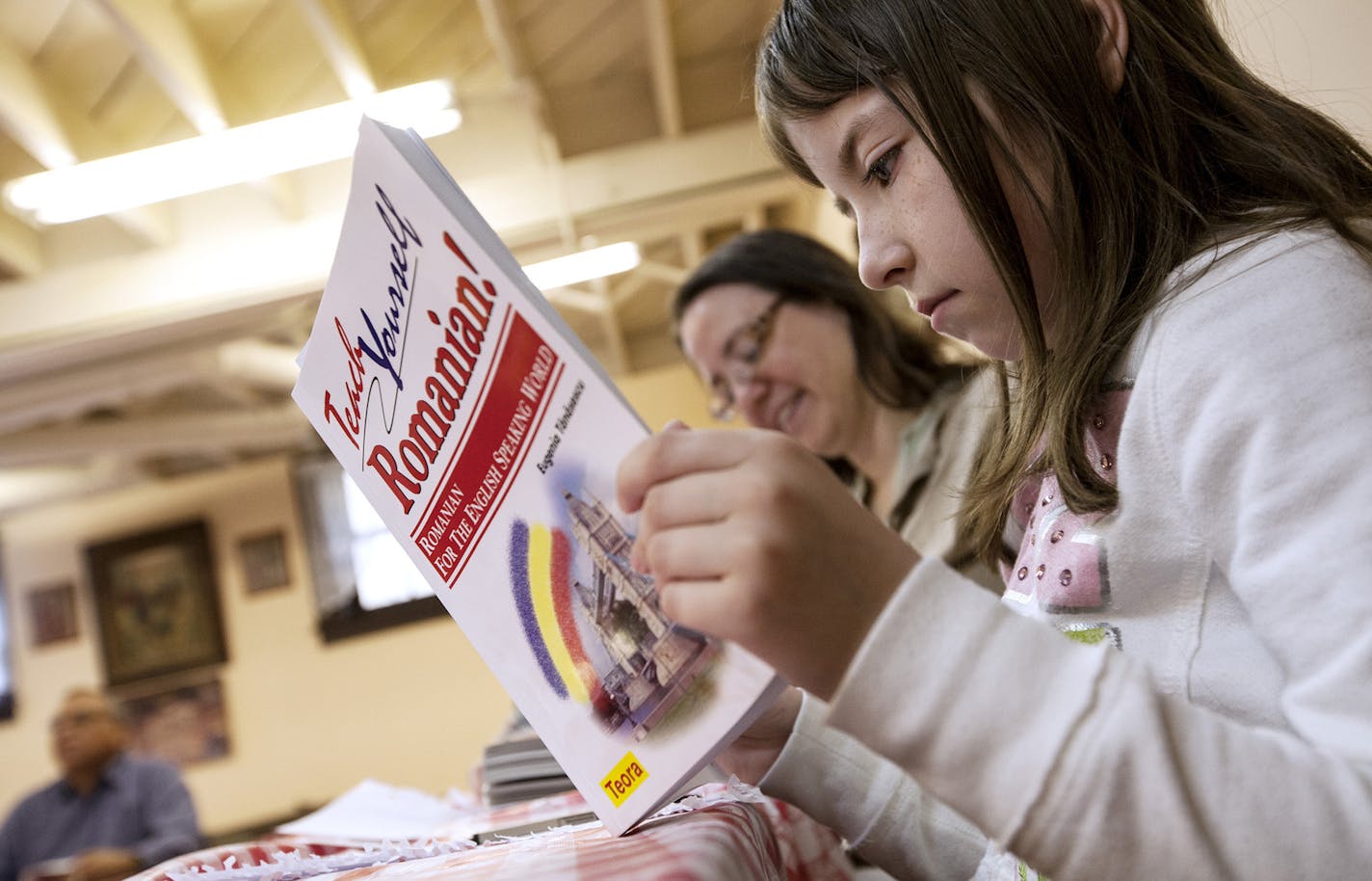 April Path, 9, looks through her textbook in Romanian language class at Saint Stephen Romanian Orthodox Church in South Saint Paul September 14, 2013. (Courtney Perry/Special to the Star Tribune)