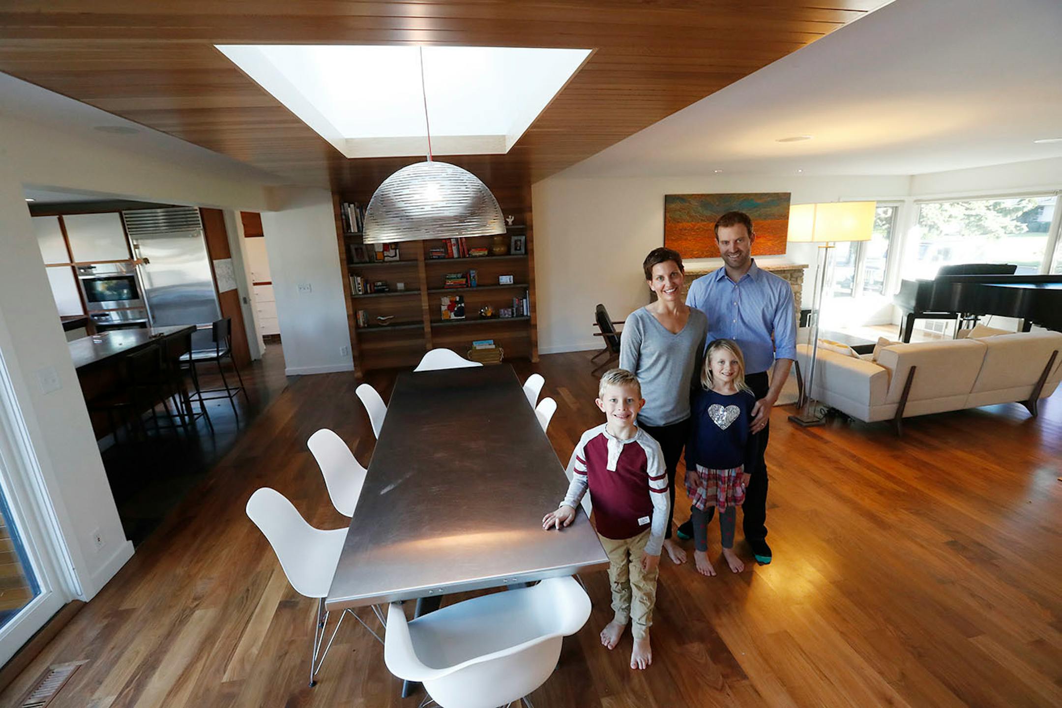 Homeowners Jill and Robert Prevost and their children Griffin and Siena inside the revived 1950s rambler.