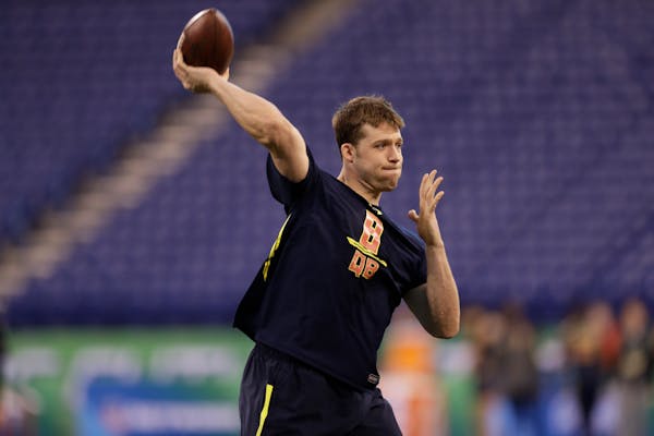Minnesota quarterback Mitch Leidner runs a drill at the NFL football scouting combine Saturday, March 4, 2017, in Indianapolis. (AP Photo/David J. Phi