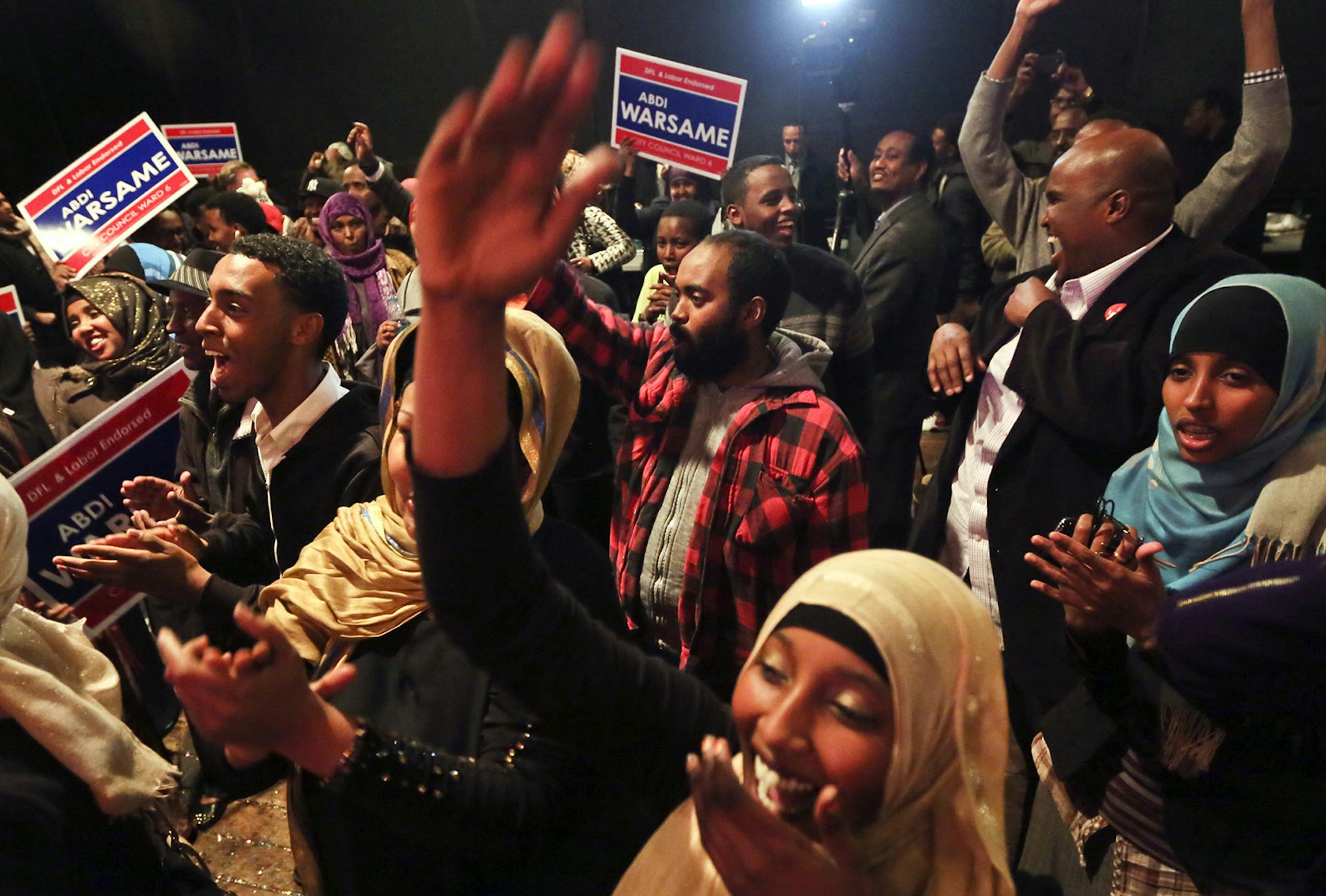 Ward 6 city council candidate Abdi Warsame's supporters erupt in celebration after it is announced tht Warsame had unofficially won the race at the Mixed Blood Theatre, where the campaign gathered for the election results and a celebration Tuesday, Nov. 5, 2013, in Minneapolis, MN. Warsame won in a landslide, garnering 64 percent of the vote and becoming the highest elected Somali-American in the country.](DAVID JOLES/STARTRIBUNE) djoles@startribune.com Minneapolis City Council race: Should know