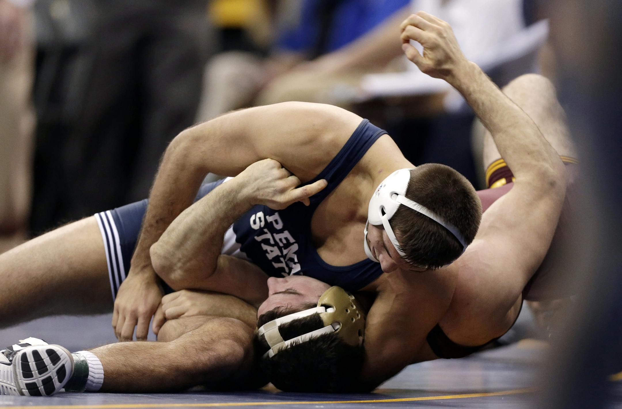 Penn State&#x2019;s undefeated Quentin Wright, top, pinned Minnesota&#x2019;s Scott Schiller during their 197-pound quarterfinal match Friday. Wright had defeated Schiller twice during the Big Ten season.