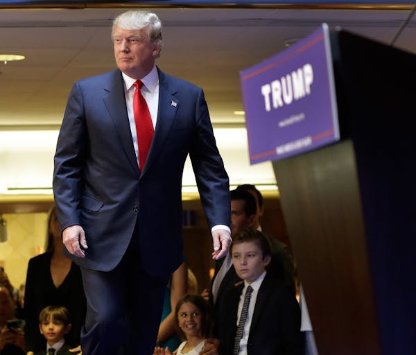 Developer Donald Trump takes the stage to announce that he will seek the Republican nomination for president, Tuesday, June 16, 2015, in the lobby of 