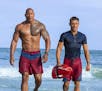 This image released by Paramount Pictures shows Dwayne Johnson as Mitch Buchannon, left, and Zac Efron as Matt Brody in "Baywatch." (Frank Masi/Paramo