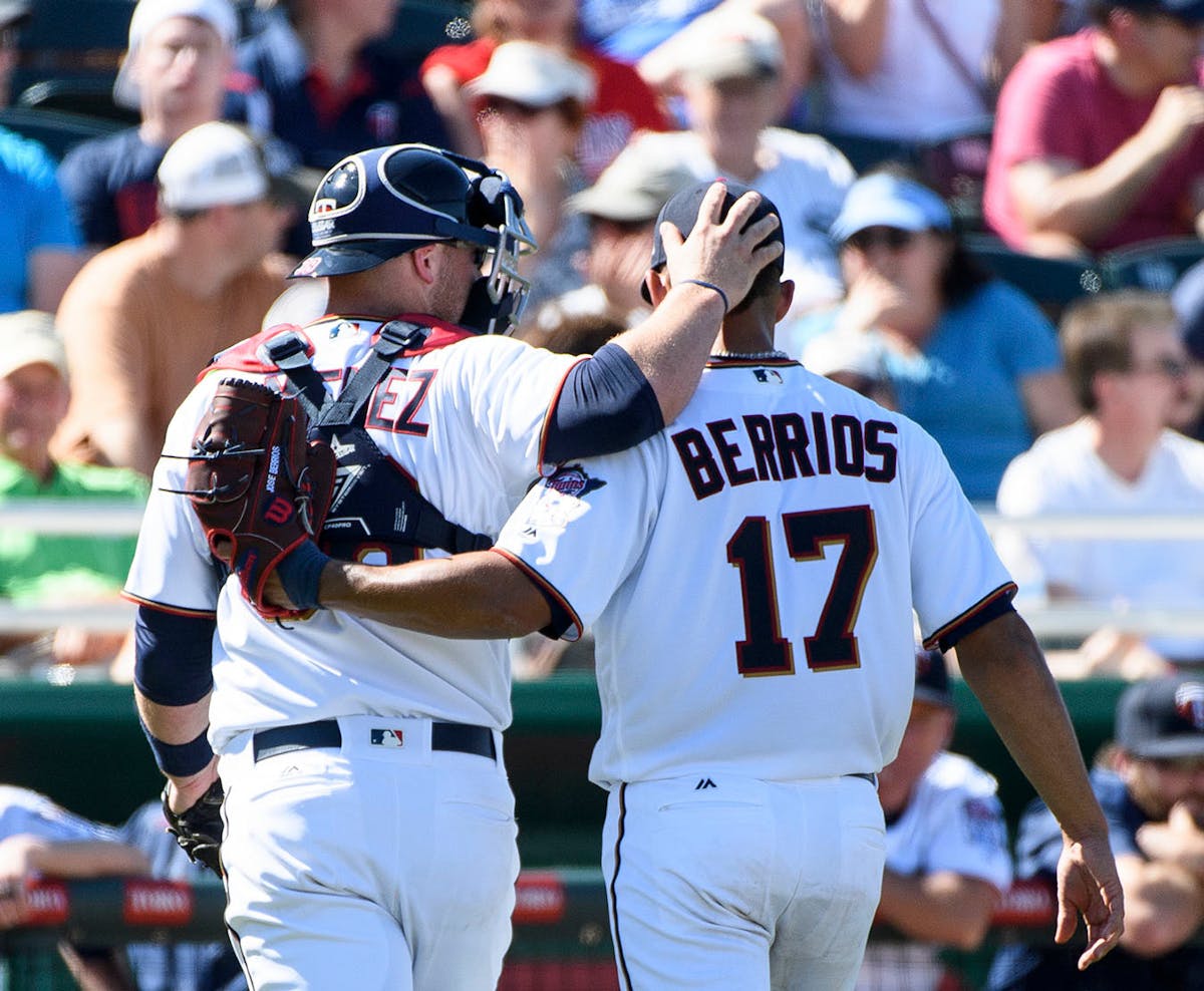 Minnesota Twins catcher Chris Gimenez (38) and pitcher Jose Berrios (17).