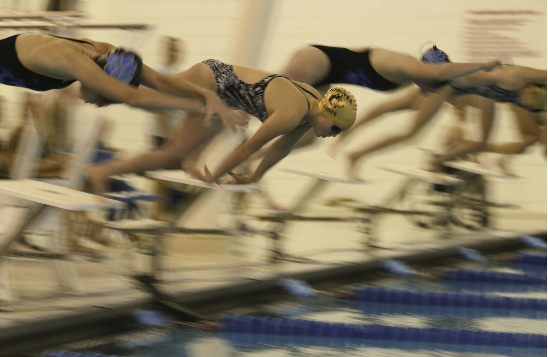 The Andover High School girl's swim team faced the Blaine High School team in a dual meet Thursday night, October 3, 2013 at Northdale Middle School in Coon Rapids. Blaine won the meet 97-87. Andover's Bella Smits dove into the pool at the start of the 200 yard freestyle, an event she won with a time of 2:00:18. ] JEFF WHEELER ‚Ä¢ jeff.wheeler@startribune.com