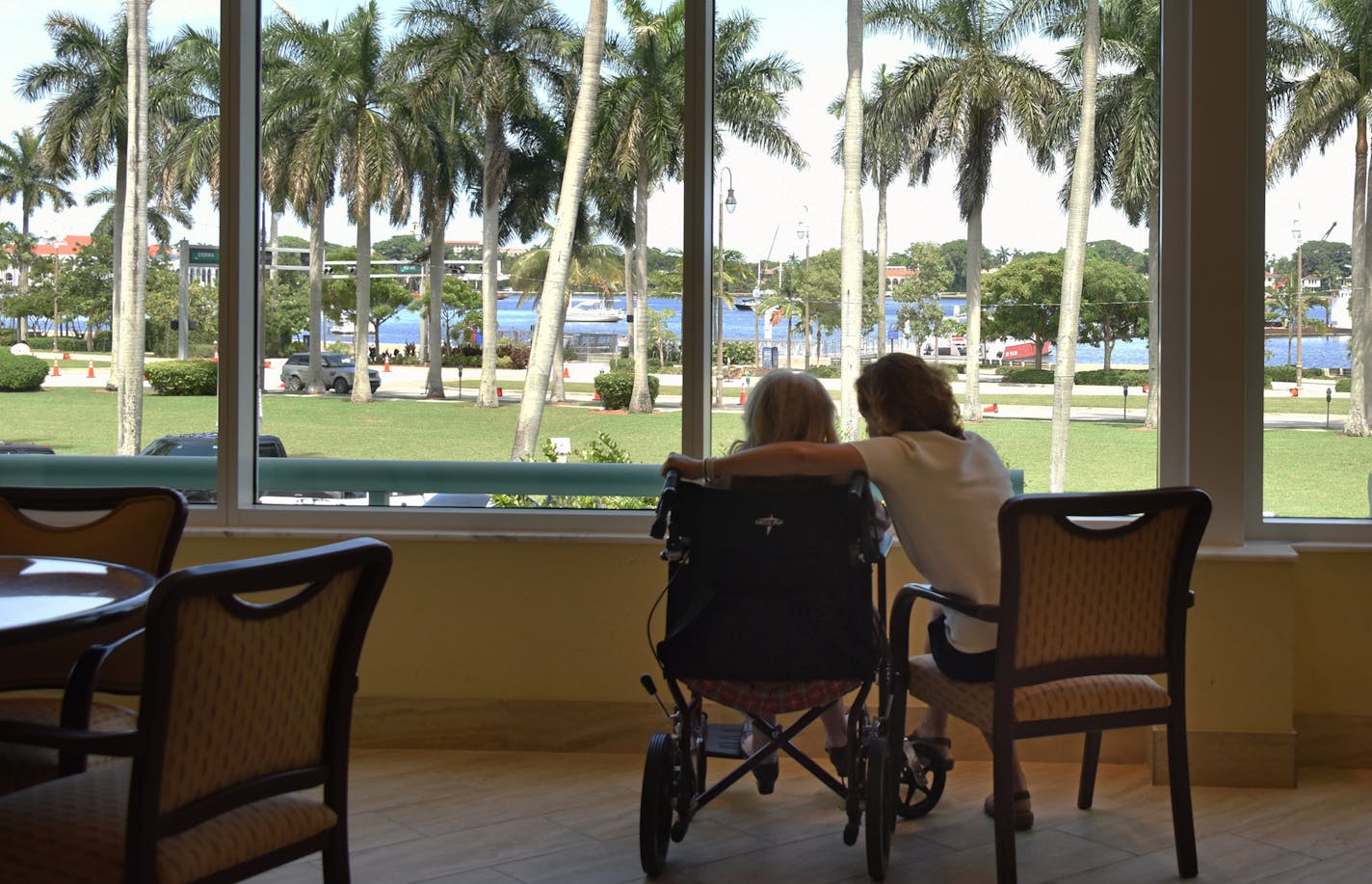 Jana Panarites with her mother, Helen, at her assisted-living facility in West Palm Beach, Fla., July 13, 2016. While caring for her mother, Panarites had to leave the work force for three years, which will mean a large reduction in her Social Security income when she retires, but a growing number of legislators and policy makers would like Panarites and other caregivers to receive some relief under Social Security expansion. (Peter W. Cross/The New York Times)