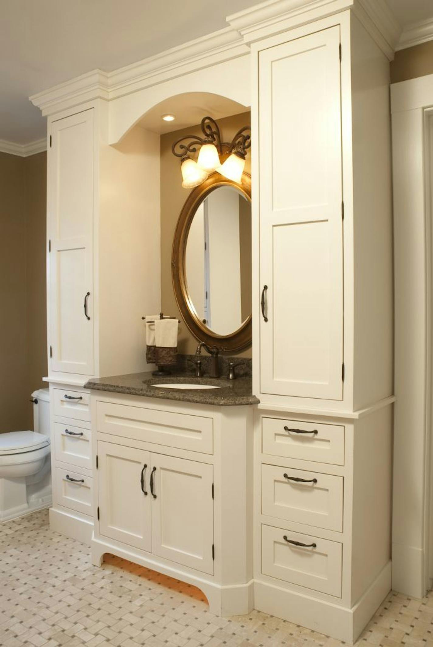 Two walls were removed to add space for an oversized shower with accent tiles and glass doors, far left. The bathroom also has a heated floor.