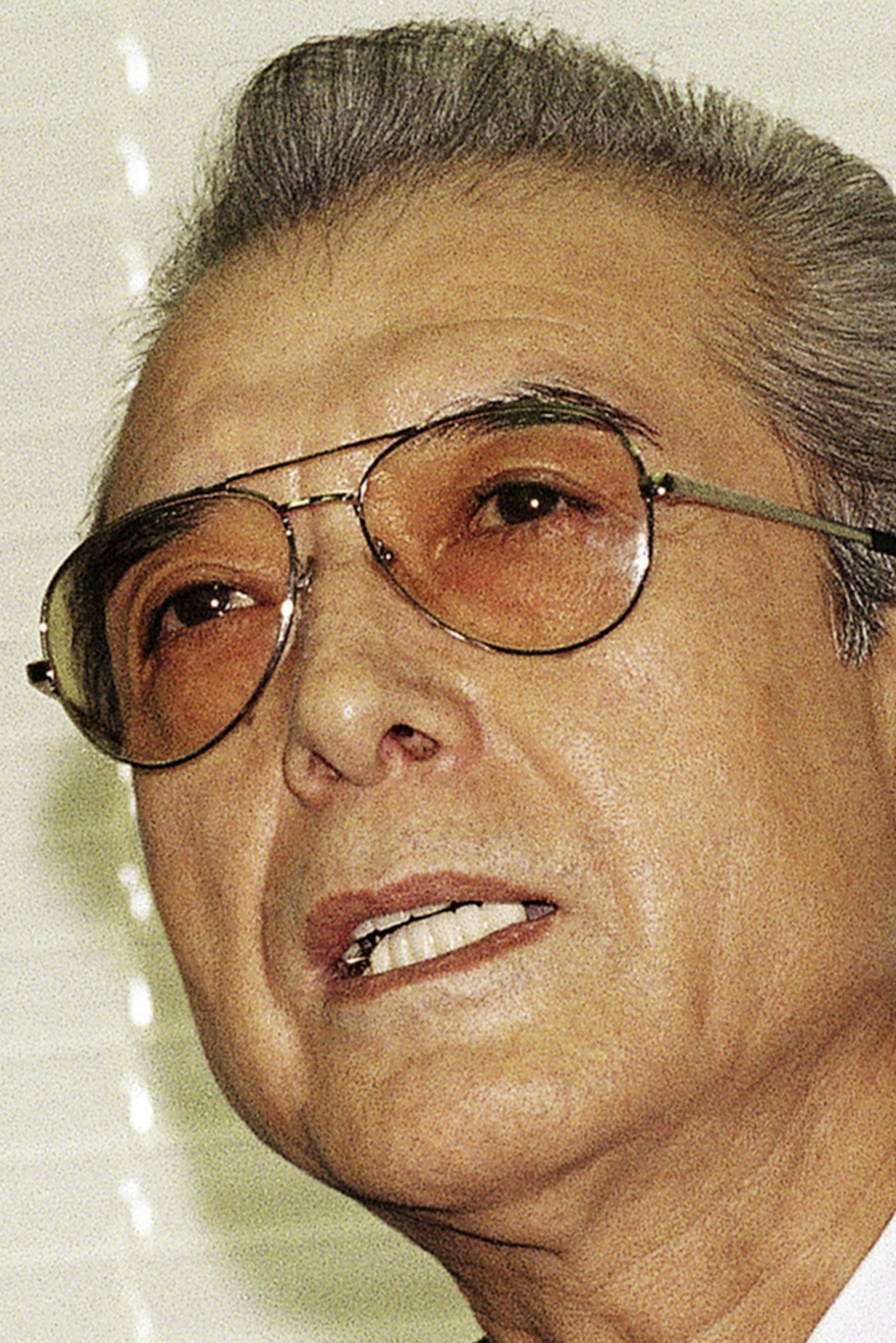FILE - In this Friday, June 12, 1992 file photo, Hiroshi Yamauchi, then-president of Japan's Nintendo Co., answers questions during a news conference after he won the final approval to buy the Seattle Mariners at the company's head office in Kyoto, western Japan. Yamauchi, who ran Nintendo for more than 50 years and led the company's transition from traditional playing-card maker to video game giant, has died of pneumonia, Thursday, Sept. 18, 2013. He was 85. (AP Photo/Katsumi Kasahara, File) OR