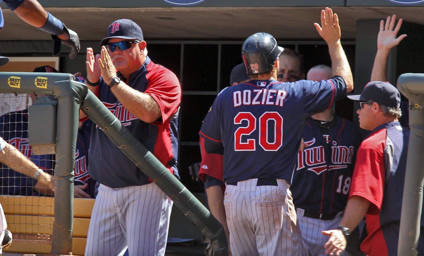 Minnesota Twins vs. Cleveland Indians. Twins won 5-1. Twins manager Ron Gardenhire, left, and players were a happy bunch as Brian Dozier scored a run in the 7th inning aiding the Twins to a 3 game sweep of the Indians. (MARLIN LEVISON/STARTRIBUNE(mlevison@startribune.com (cq program)