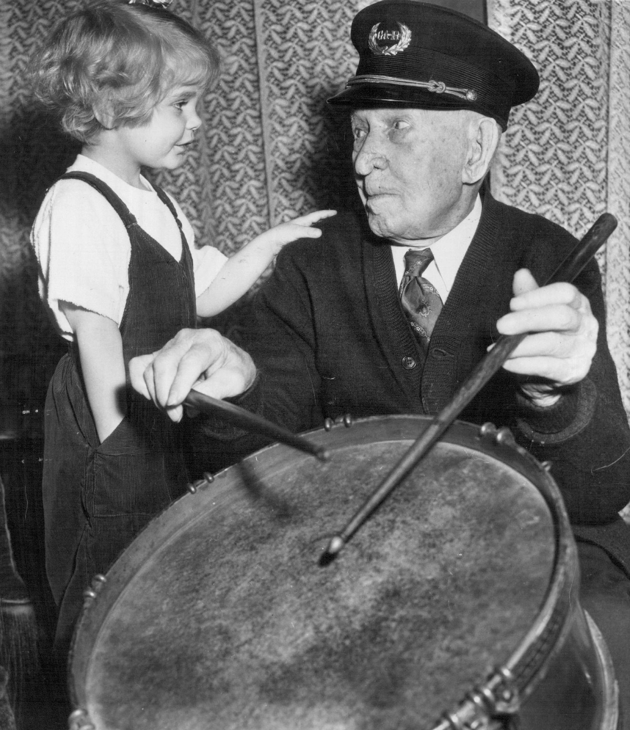 August 2, 1956 Albert Henry Woolson, 106, shows his granddaughter, 3-year-old Frances Anne Kobus, how he played a drum during the Civil war. May 24, 1953 Minneapolis Star Tribune