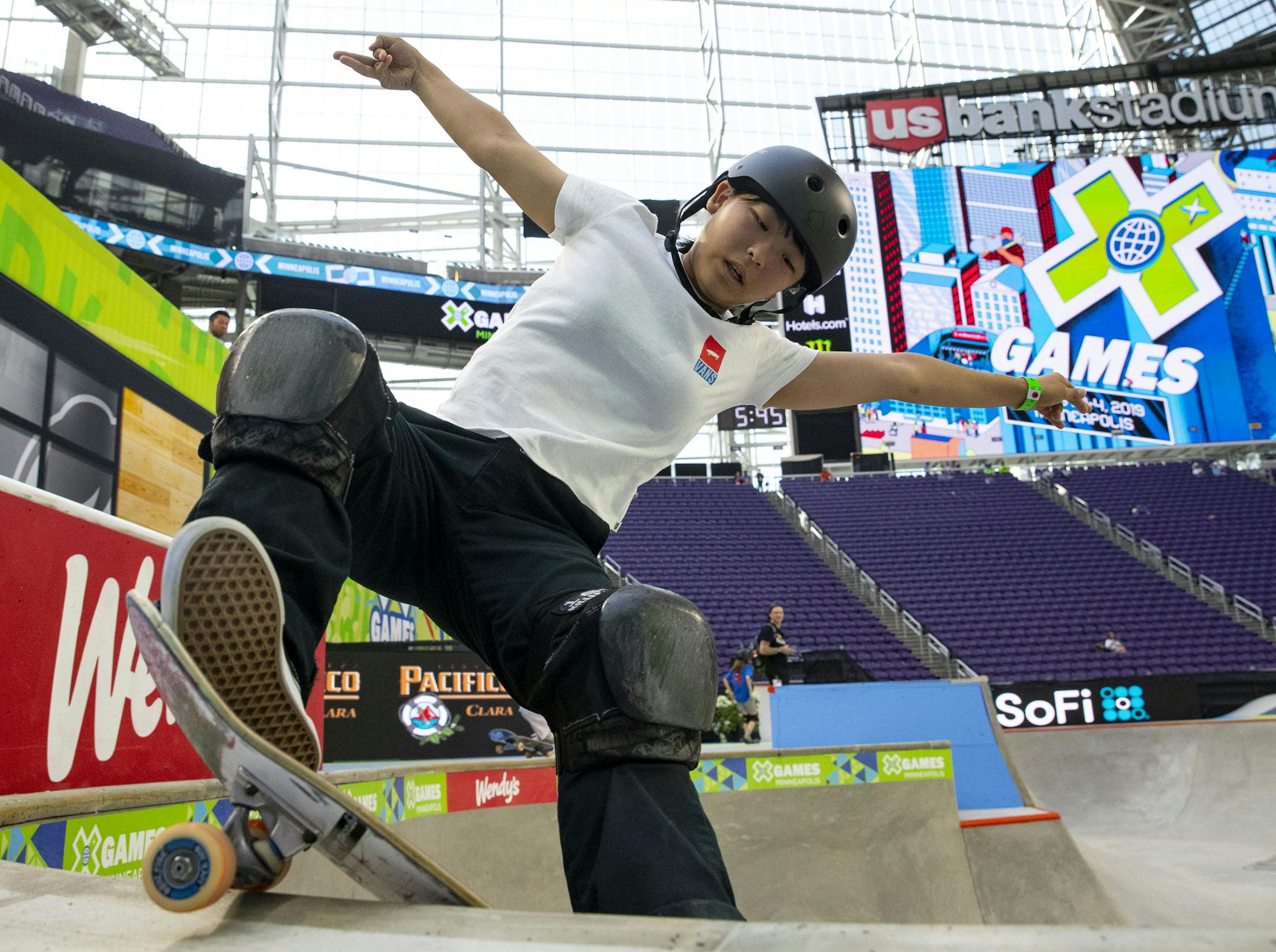 Misugu Okamoto, a young skateboarder from Japan, practiced her tricks for the women's skateboard street competition.] ALEX KORMANN • alex.kormann@startribune.com The first day of X Games competition kicked off Thursday August 1, 2019 at U.S. Bank stadium with many of the big air events.