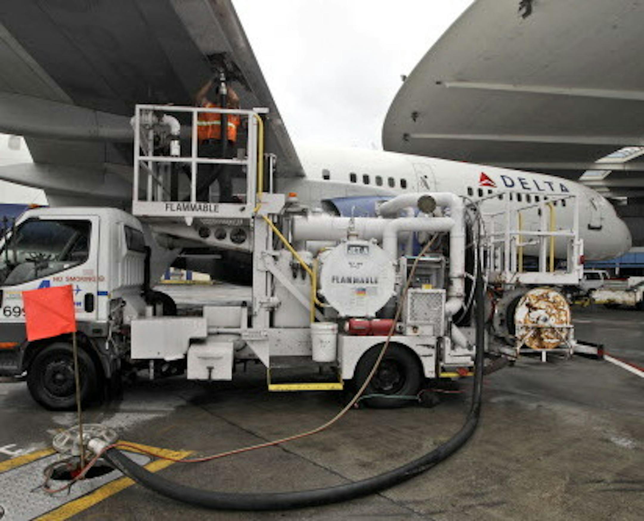 In this Wednesday, Aug. 1 2012 photo, a Delta Air Lines grounds refuels a departing flight at JFK International airport in New York. (AP Photo/Mary Altaffer)