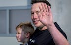 FILE - Tesla CEO Elon Musk waves as he leaves the Tesla Gigafactory for electric cars after a visit in Gruenheide near Berlin, Germany, March 13, 2024