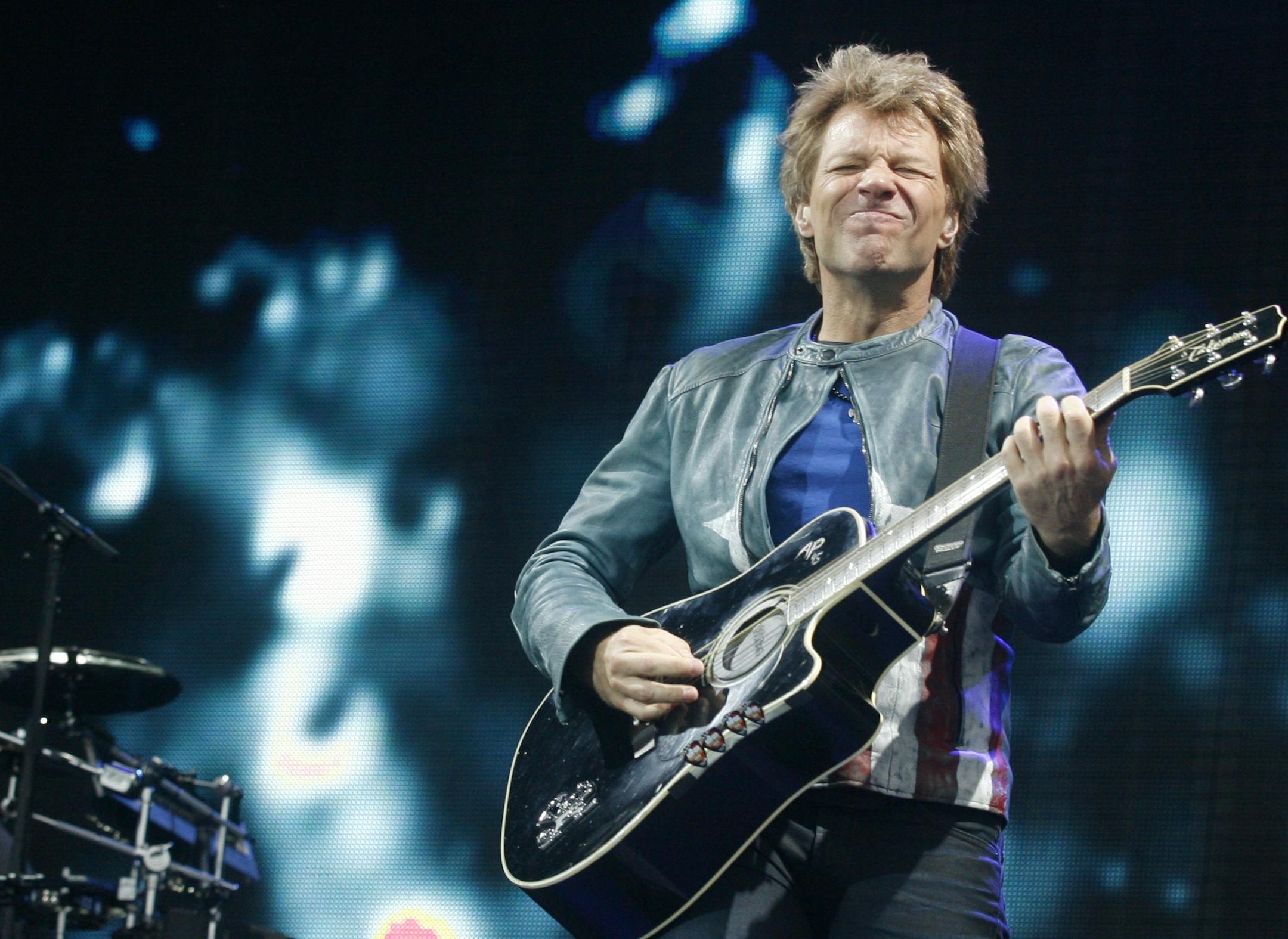 Jon Bon Jovi of Bon Jovi performs at Isle of Wight Festival in Newport on the Isle of Wight on Sunday, June 16, 2013. Thousands of people are to attend the three day event with headliners, the Stone Roses, the Killers and Bon Jovi.(Photo by Jim Ross/Invision/AP) ORG XMIT: MIN2013061616363256