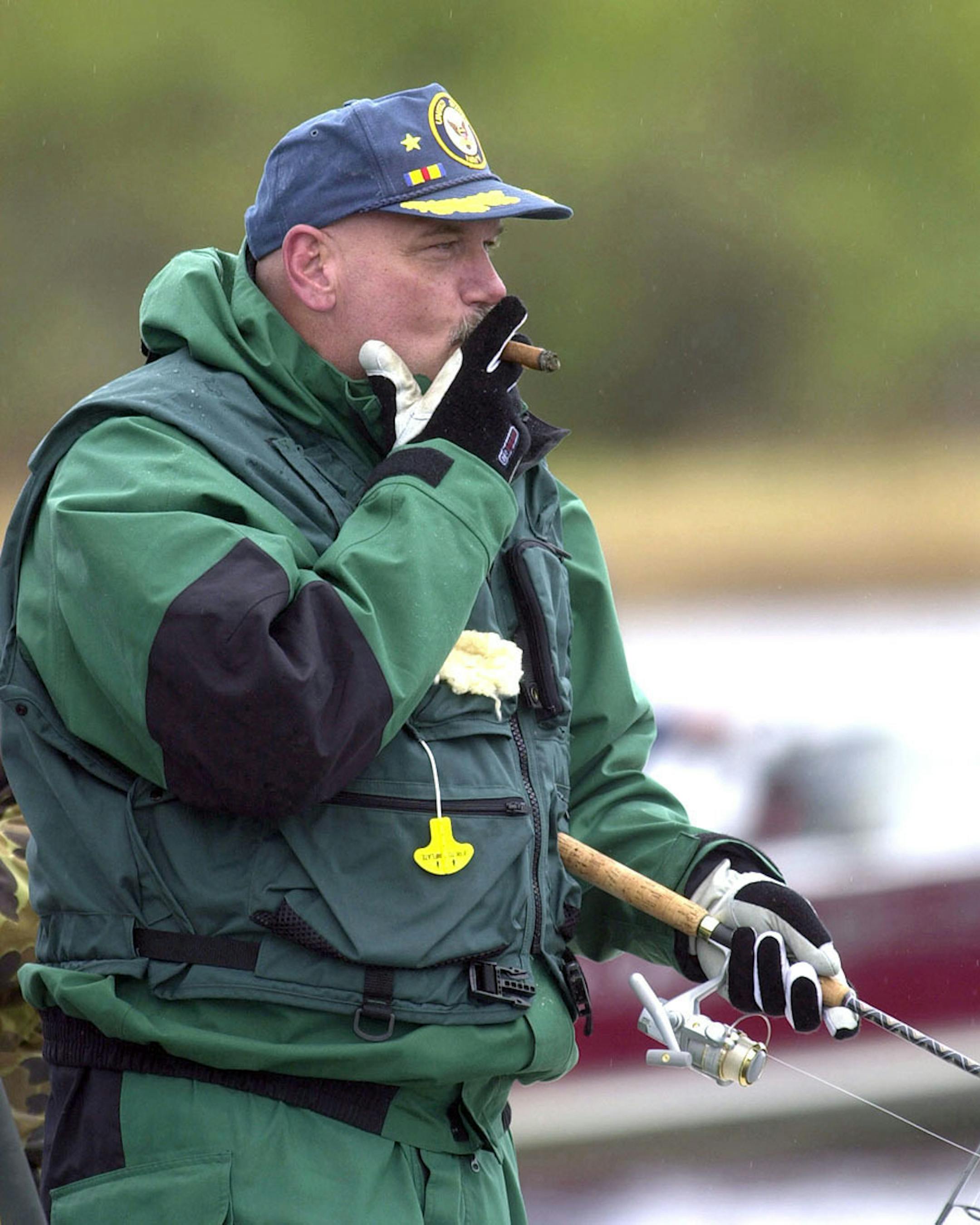 Governor Jesse Ventura enjoyed his cigar as he watched his line in the waters below the rapids of Vermilion Gorge at Crane Lake later in the morning of 5/14/00. Ventura caught four walleye and four northern pike, and returned them all to the water. "If I want fish, I will head to the store," Ventura said. "This way you can catch them again."