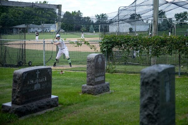The baseball field in Farming, Minn., is right next to the town’s cemetery.